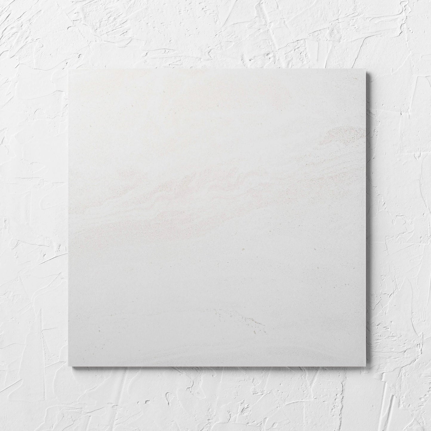 Argyle Stone Talco 300x300mm tile laid flat on a white rendered wall, showing the tile surface