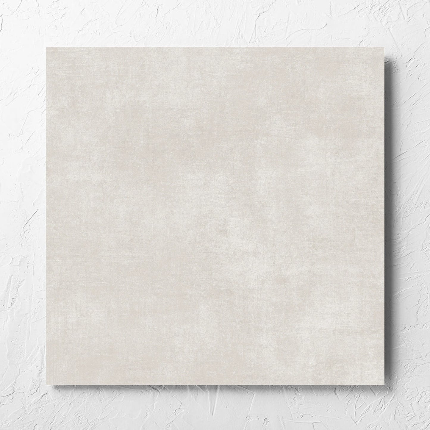 Bayside Champagne Natural Matt 600x600mm tile laid flat on a white rendered wall, showing the matt surface