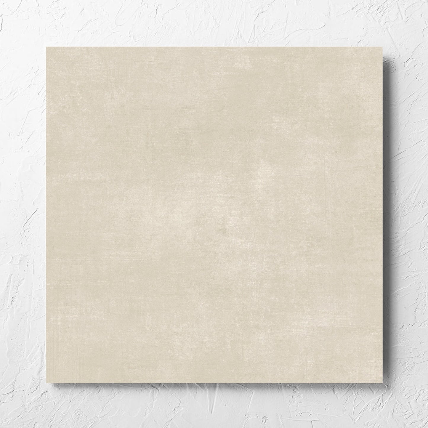Bayside Sand Natural Matt 600x600mm tile laid flat on a white rendered wall, showing the matt surface