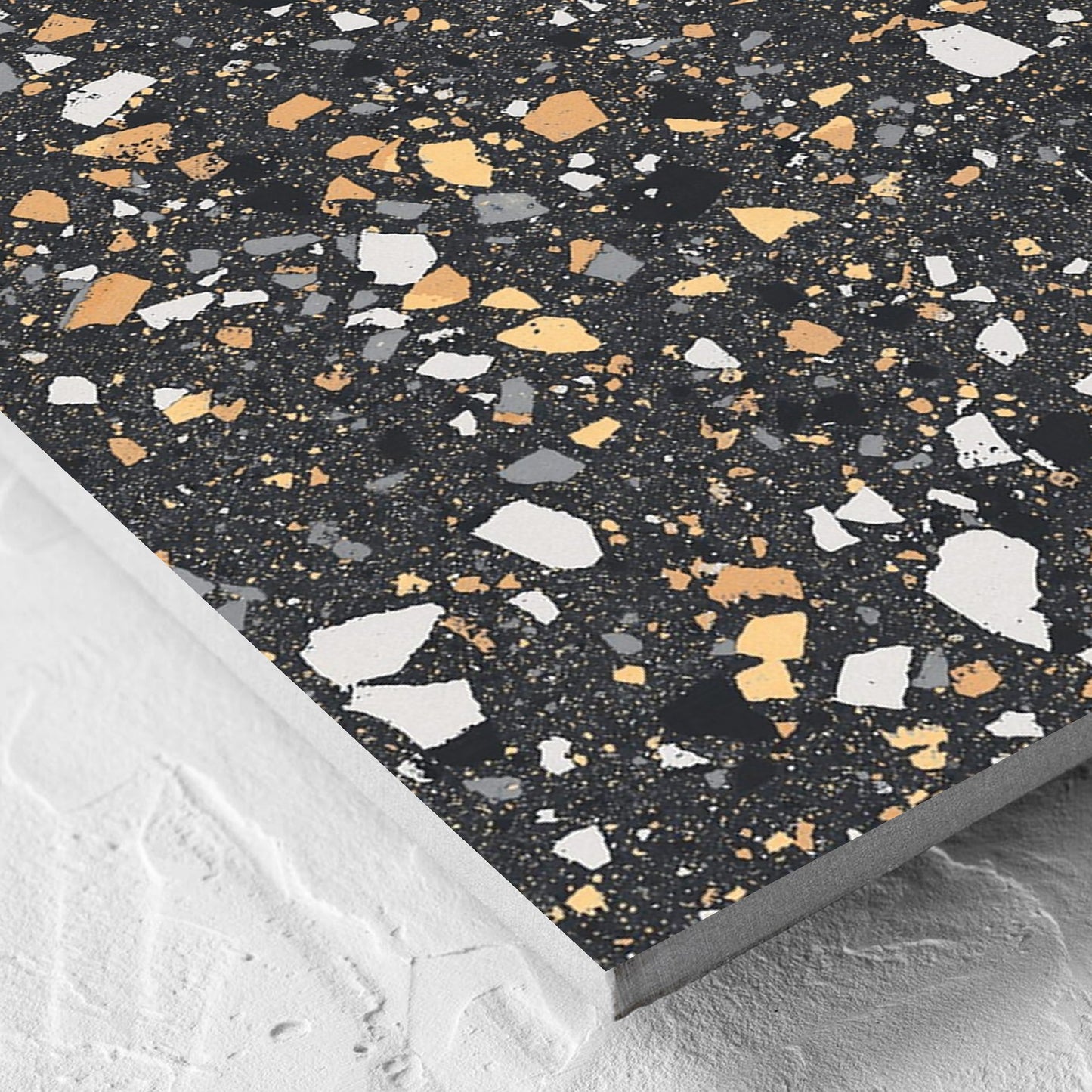 Corner close-up of the C Venice 600x600 Matt Graphite Terrazzo Look Rectified tile showing the tile surface and the edge profile