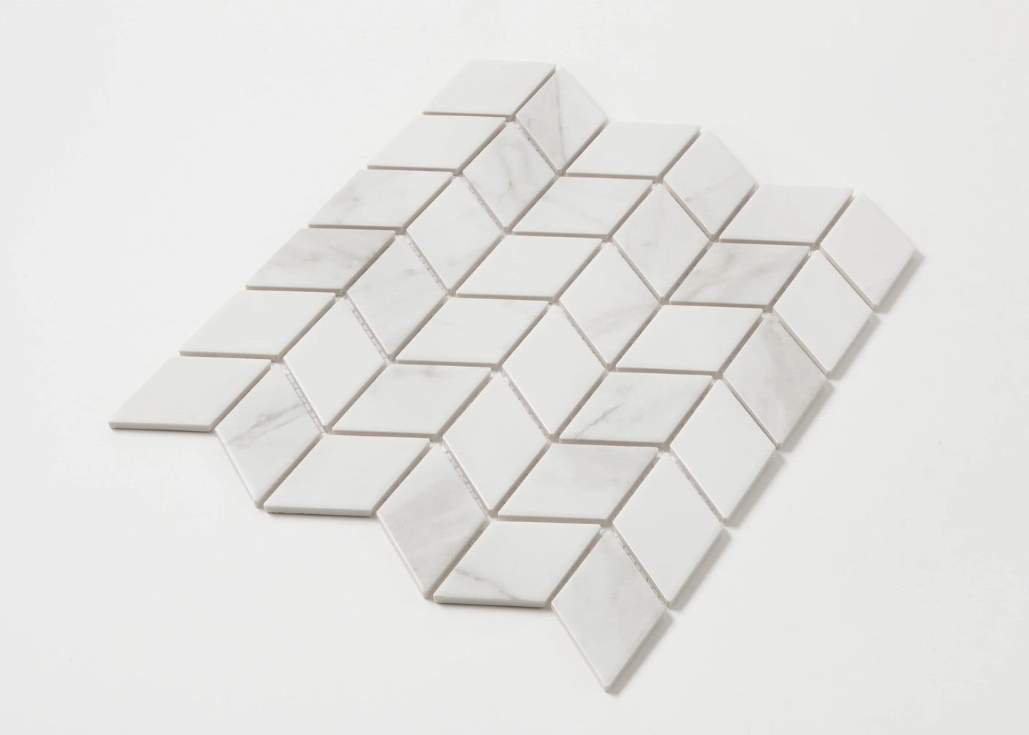 Pack shot of Carrara Look Matte Porcelain Glazed Rhombus 48x48mm tiles arranged in a diamond mosaic sheet showing white marble-look finish with subtle grey veining.