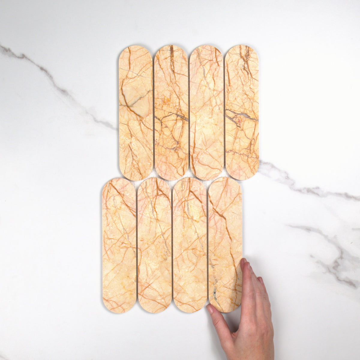 Elementa Cream Block Cylinder Mosaic 50x198mm top view, hand for scale