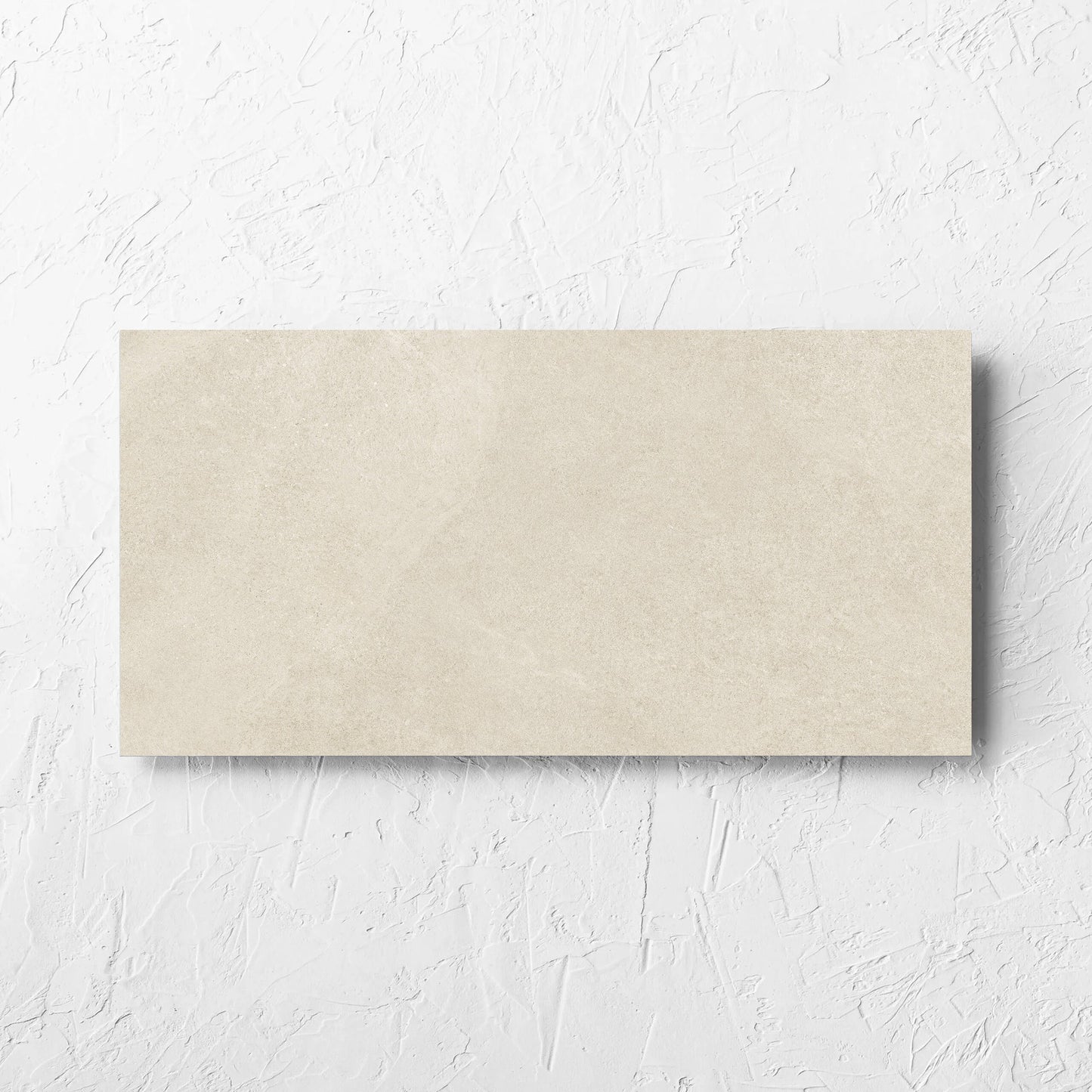 Fusion Beige Ultra Tech 300x600mm tile laid flat on a white rendered wall, showing the matt surface