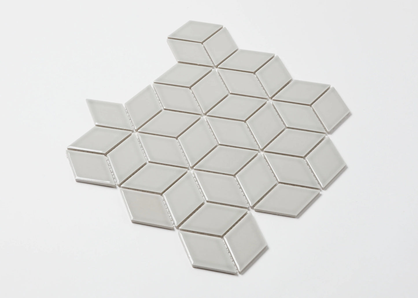 Pack shot of Grey Gloss Cube 48x48mm mosaic tile sheet featuring diamond-shaped gloss ceramic tiles arranged in a 3D cube optical illusion pattern.