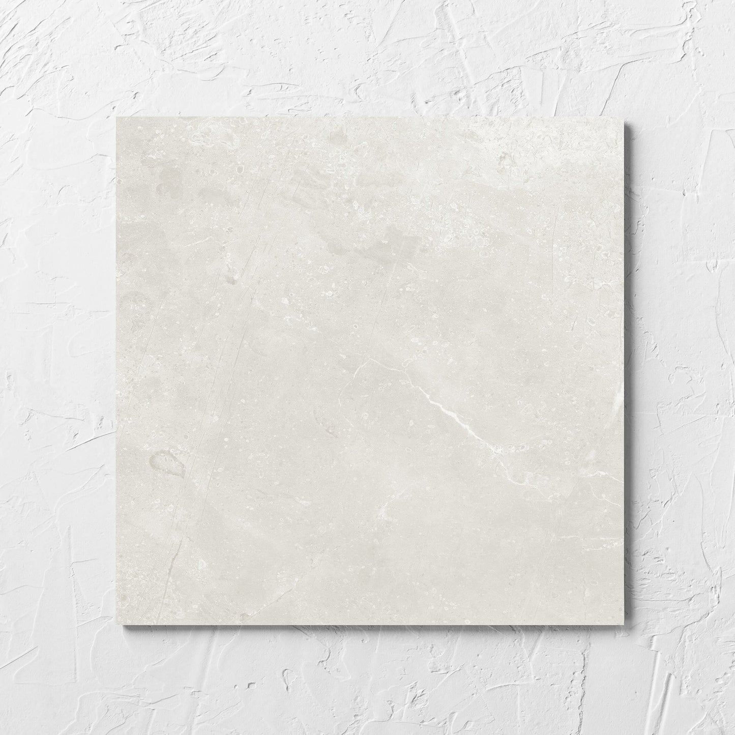 Kashmir Natural Matt 300x300mm tile laid flat on a white rendered wall, showing the matt surface