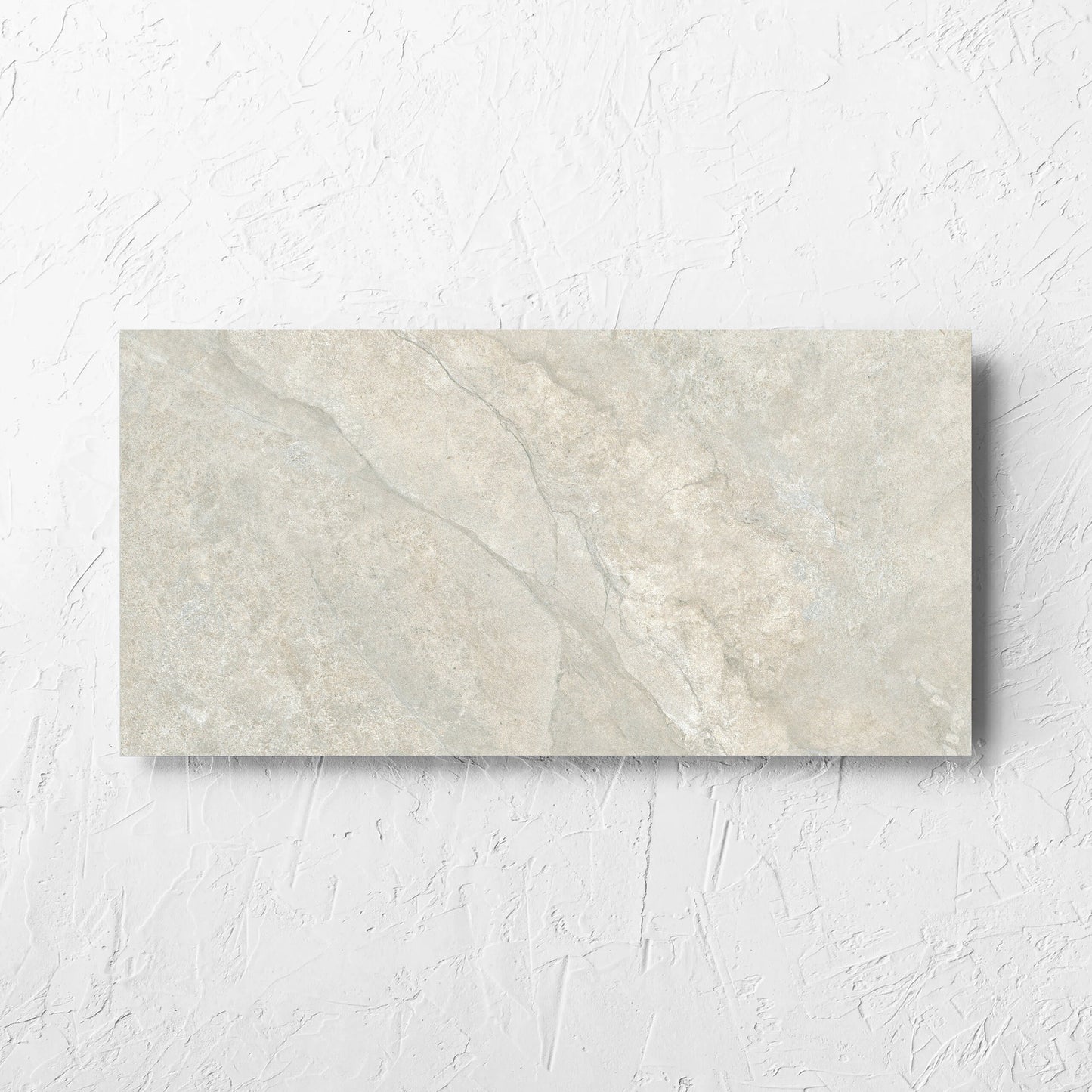 Lakestone Grey Matt 300x600mm tile laid flat on a white rendered wall, showing the matt surface