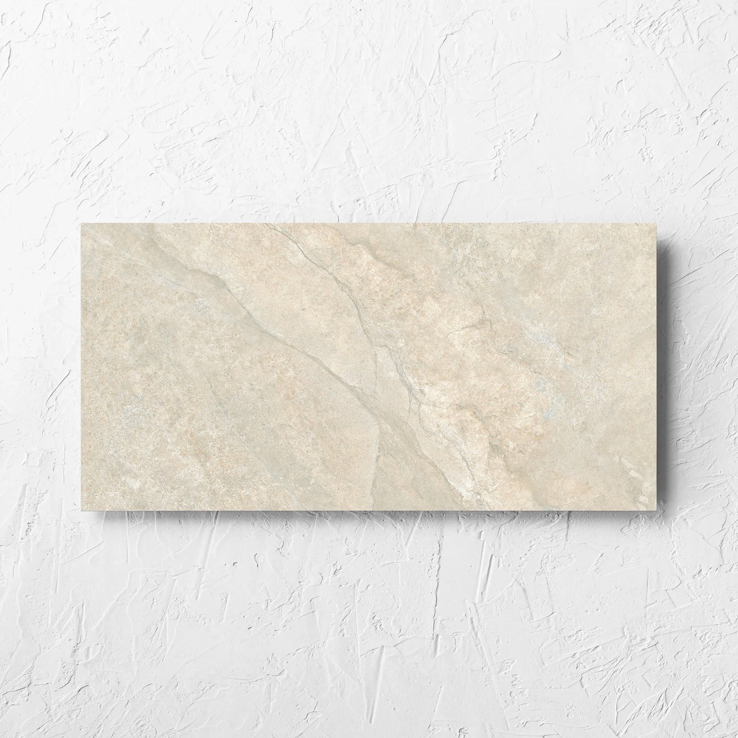 Lakestone Natural Matt 300x600mm tile laid flat on a white rendered wall, showing the matt surface