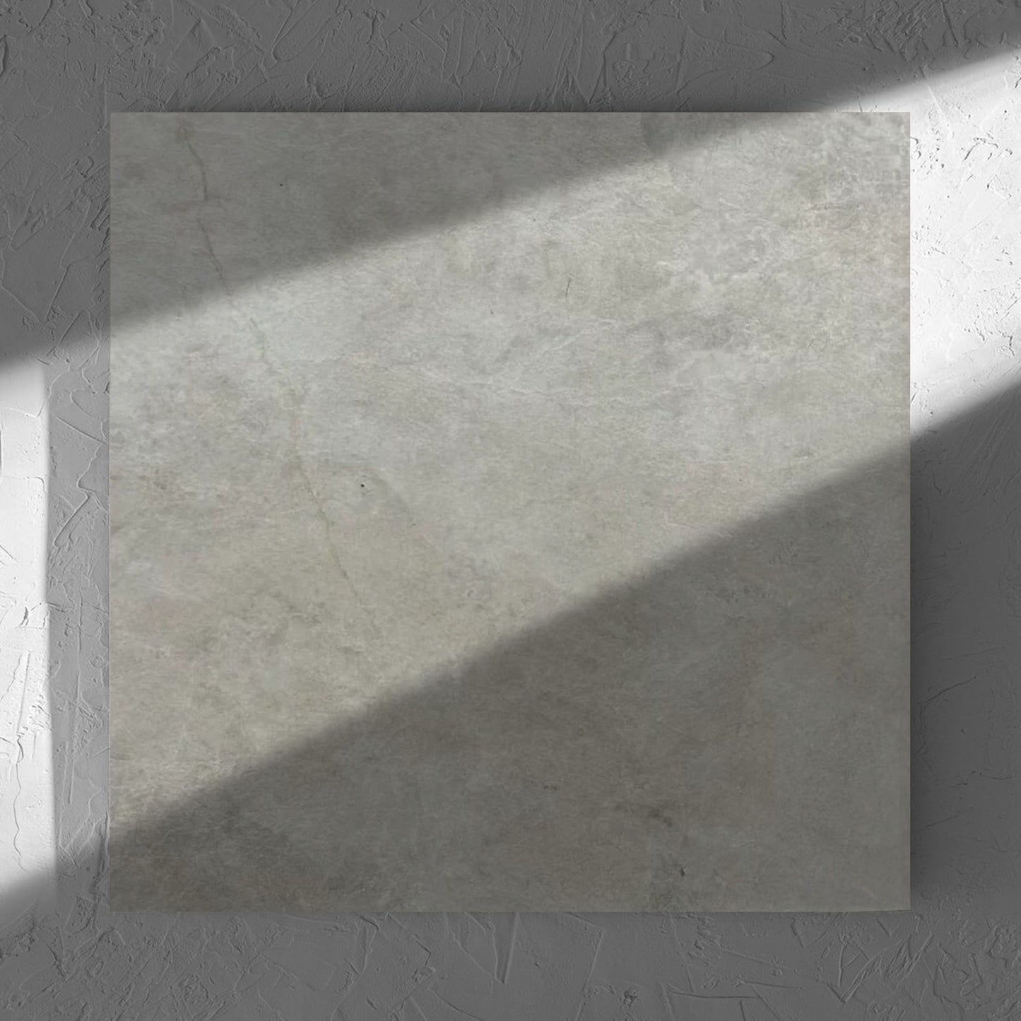 Memory Stone Bianco Matt 600x600mm tile in soft natural window light, showing the tile surface