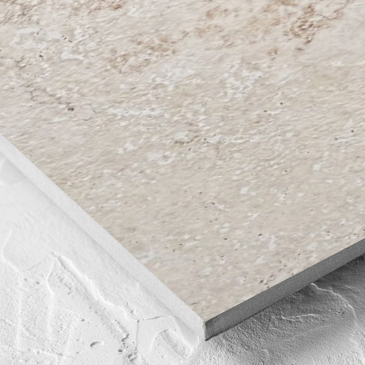 Corner close-up of the Norcia Travertine Beige 300x600mm tile showing the beige travertine surface and the edge profile