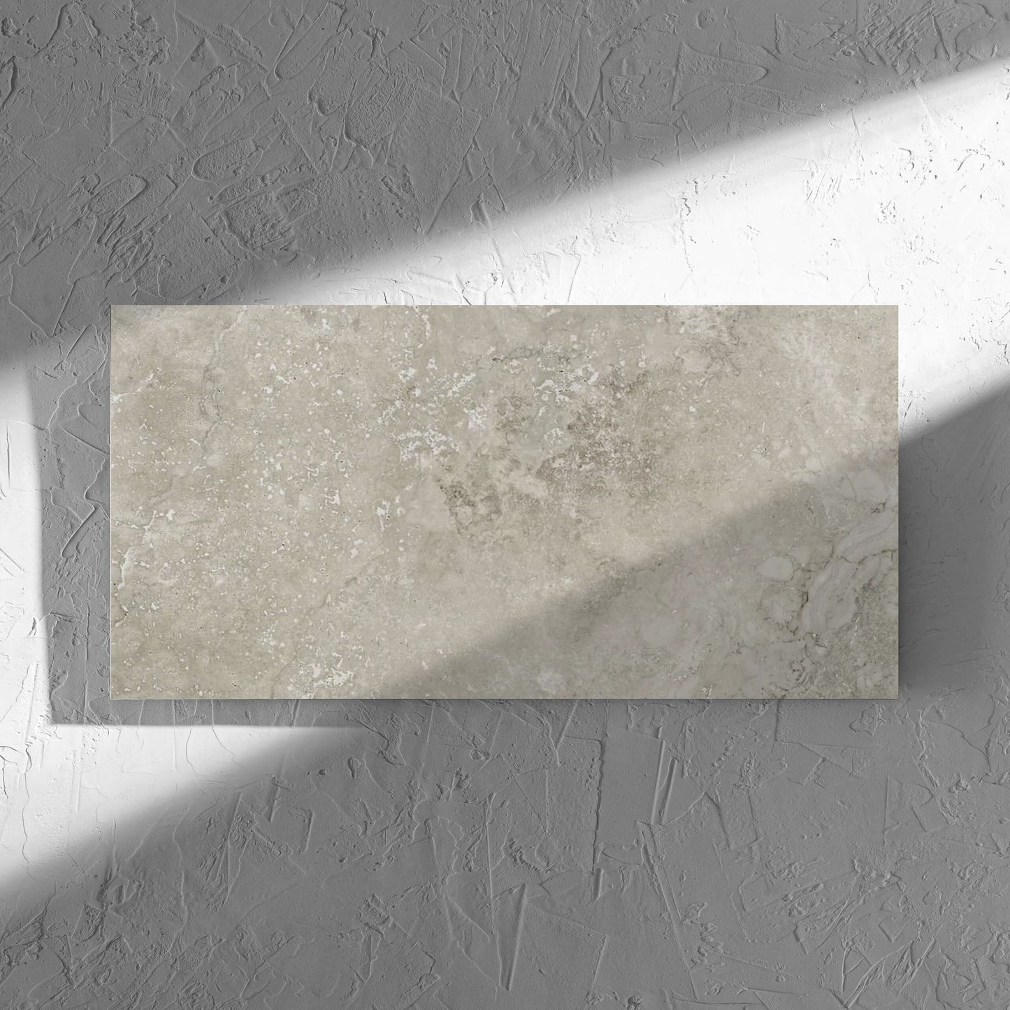 Norcia Travertine Grey 300x600mm tile in soft natural window light, showing the tile surface