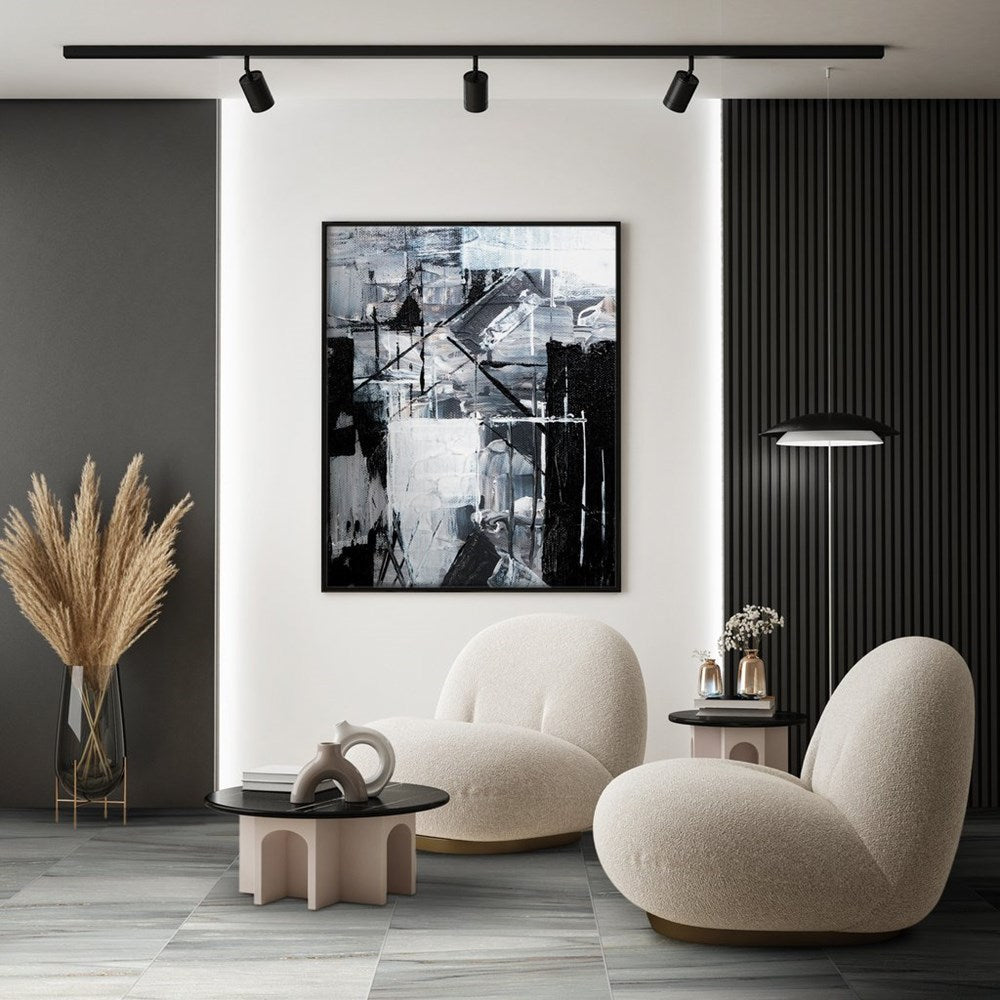 Nuovi Marmi Palissandro Lappato 600x600mm tiles laid on a living room floor featuring bouclé armchairs, black abstract wall art, and a dark slatted feature wall.