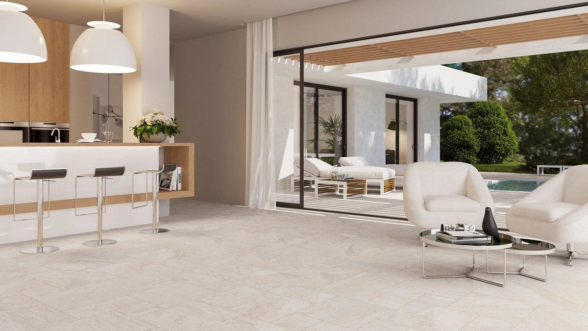 Oberon White Modular French Pattern Structured tiles covering an open-plan living and kitchen floor, complemented by white pendant lights and poolside views.