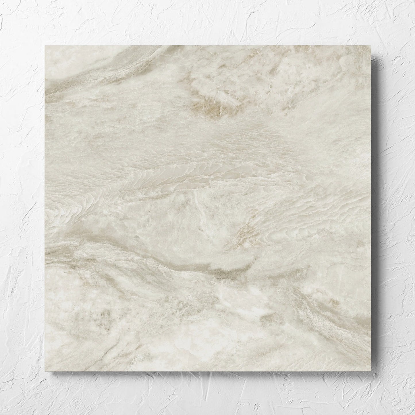 Onyx Beige Matt 600x600mm tile laid flat on a white rendered wall, showing the matt surface