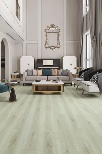 Seashell Urban Laminate 12mm Flooring 12mm installed in an elegant living room featuring a grey sofa, gold coffee table, and grand piano.