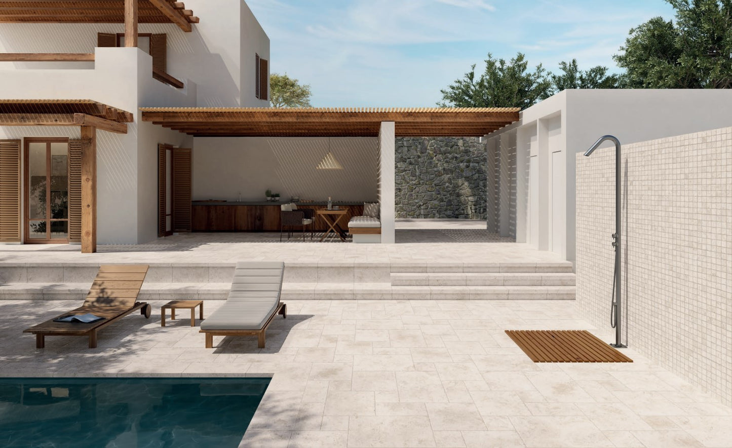 Tibur Bianco Modular 600x600mm light beige stone-look tiles laid across a Mediterranean-style outdoor pool terrace with timber loungers and pergola.