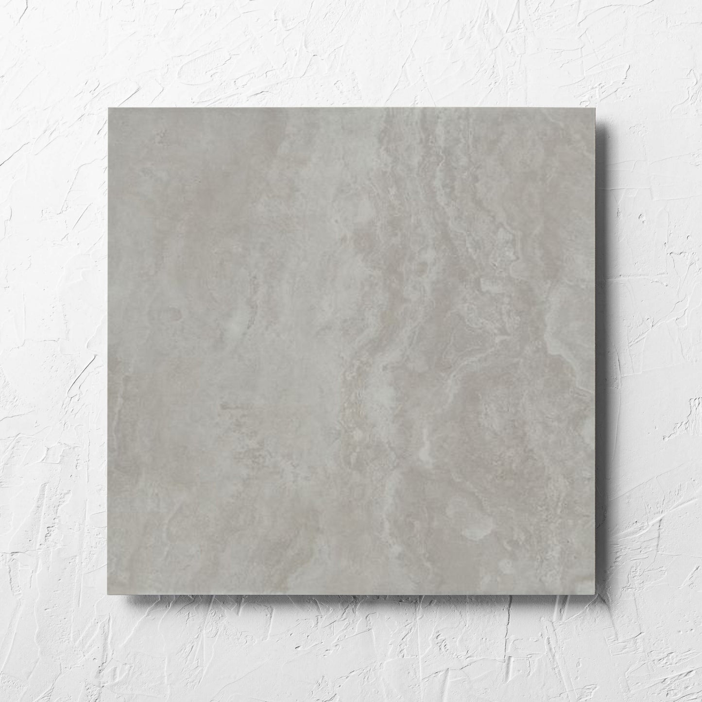 Tivoli Grey Grip 450x450mm tile laid flat on a white rendered wall, showing the matt surface