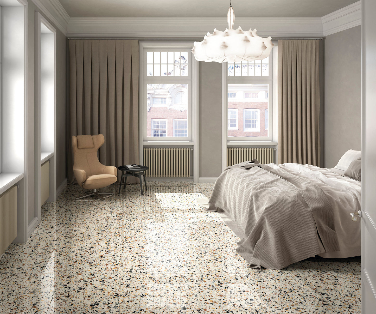Venice Ivory 600x600mm Matt Terrazzo External Tile installed in a bright bedroom with a lounge chair, pendant light, and large windows.