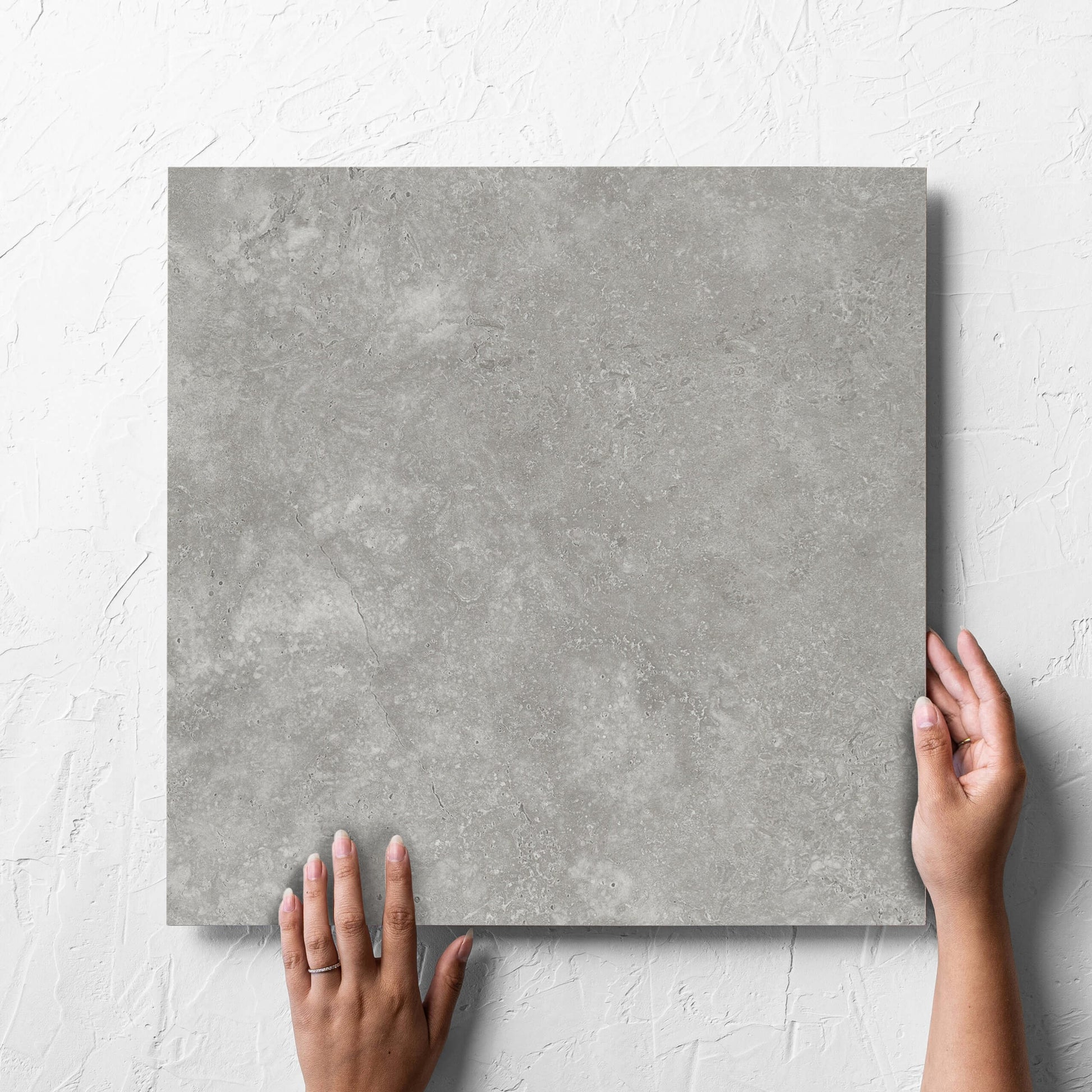 Fossil Stone Pebble Matt 450x450mm hand 3