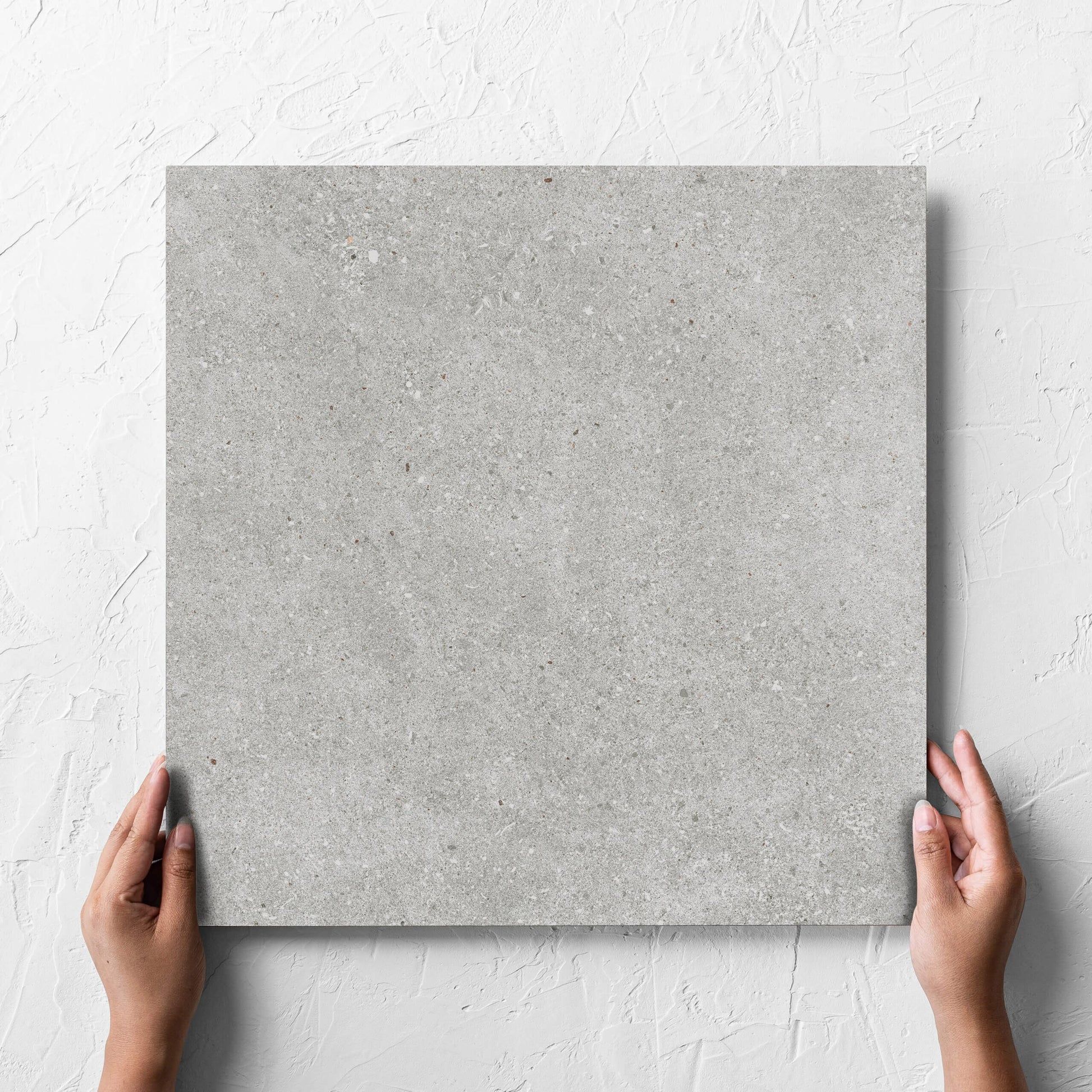 Serenity Concrete Grey Matt 450x450mm hand 5