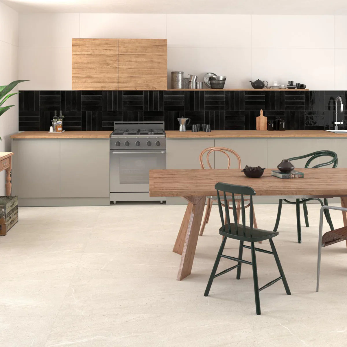 Agadir Noche 70x280mm black gloss tiles installed as a herringbone kitchen splashback, paired with sage cabinetry, wood countertops, and a rustic dining table.