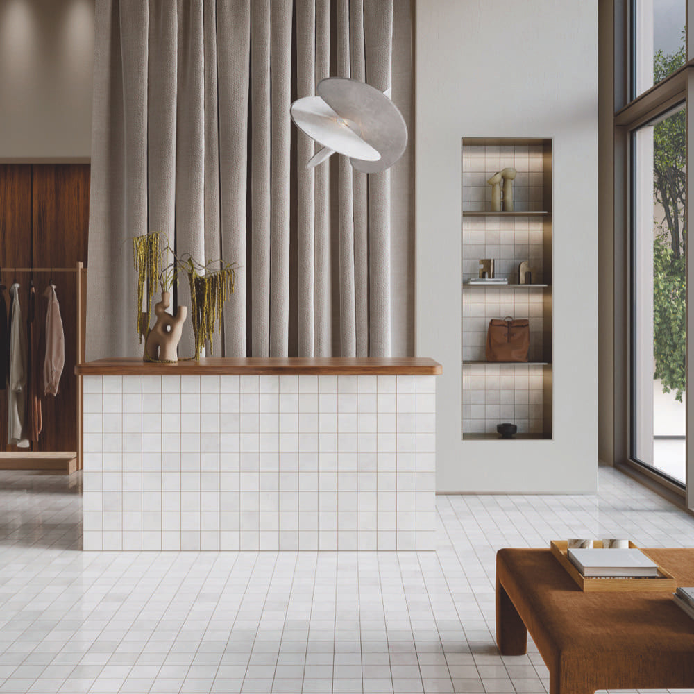 Alchemica Cenere Gloss 100x100mm tiles in a shop interior