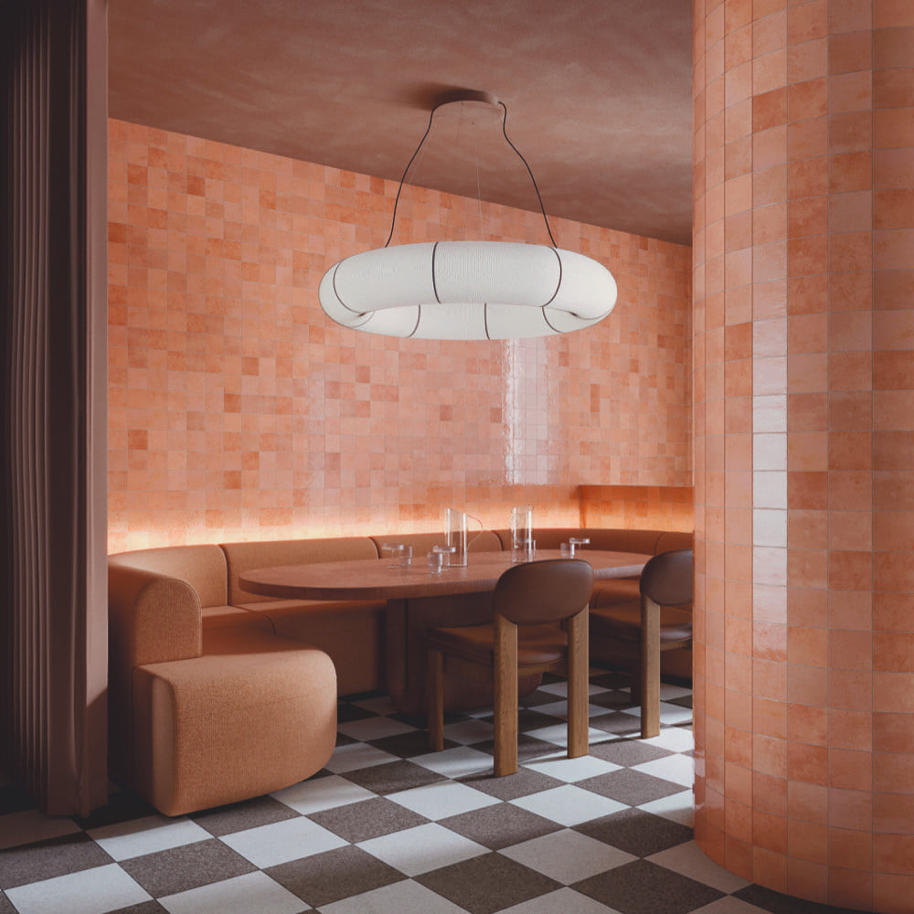 Alchemica Corallo Gloss 100x100mm tiles in a restaurant interior
