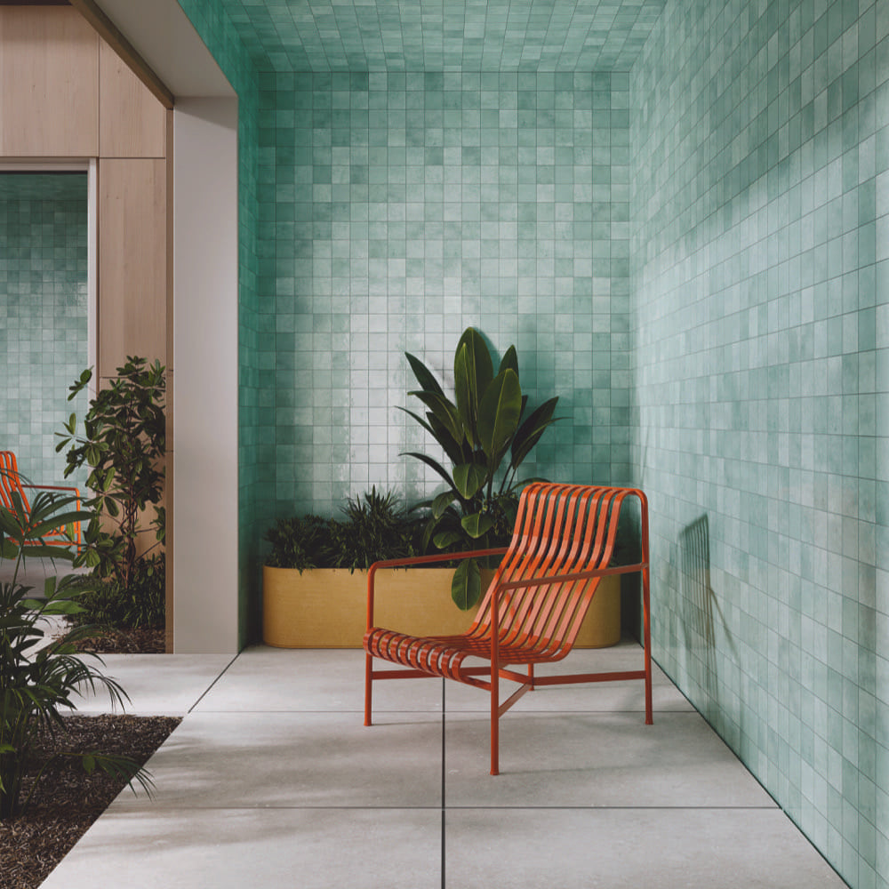 Alchemica Verdea Gloss 100x100mm tiles in a courtyard