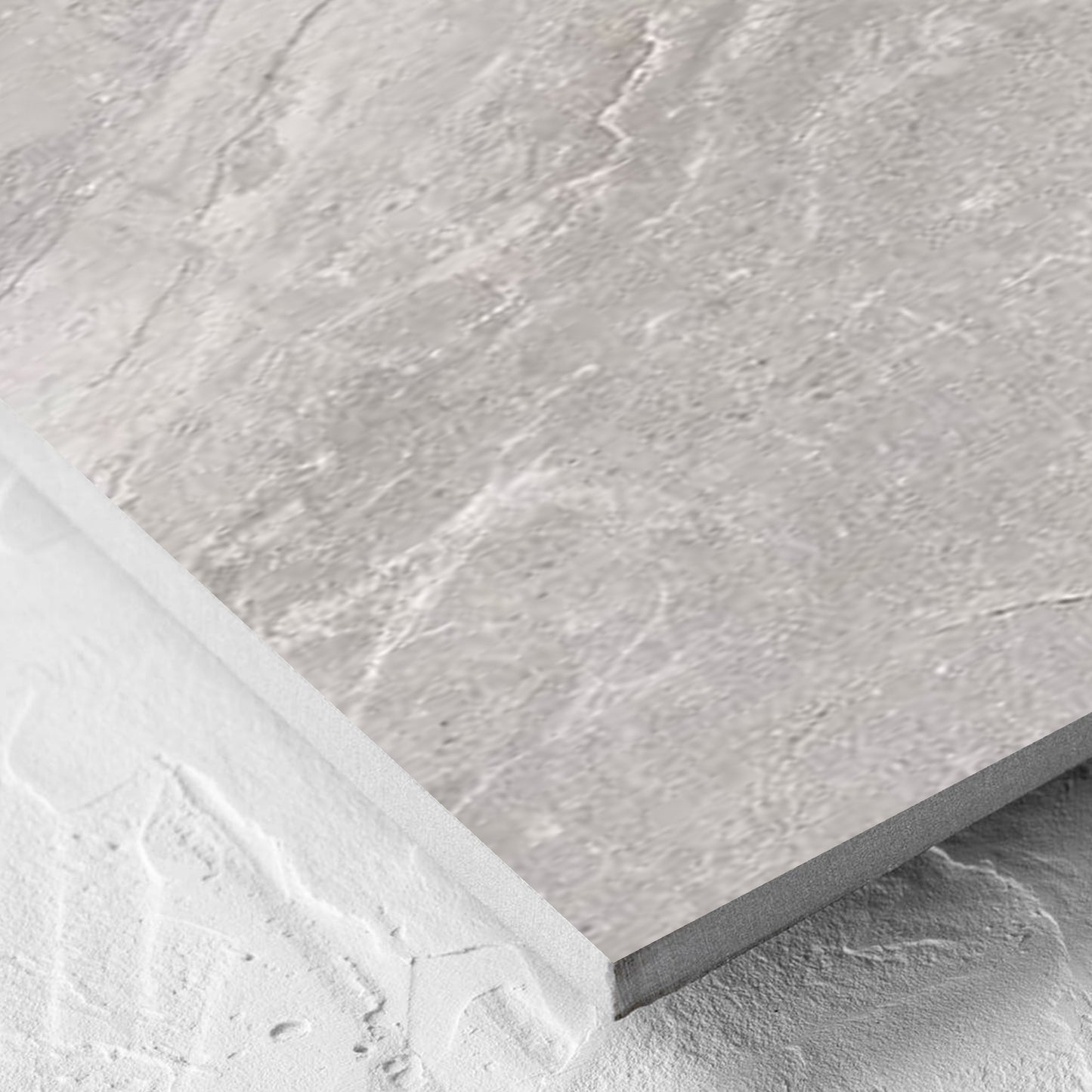 Corner close-up of the Alpen Stone Grey 300x600mm tile showing the tile surface and the edge profile