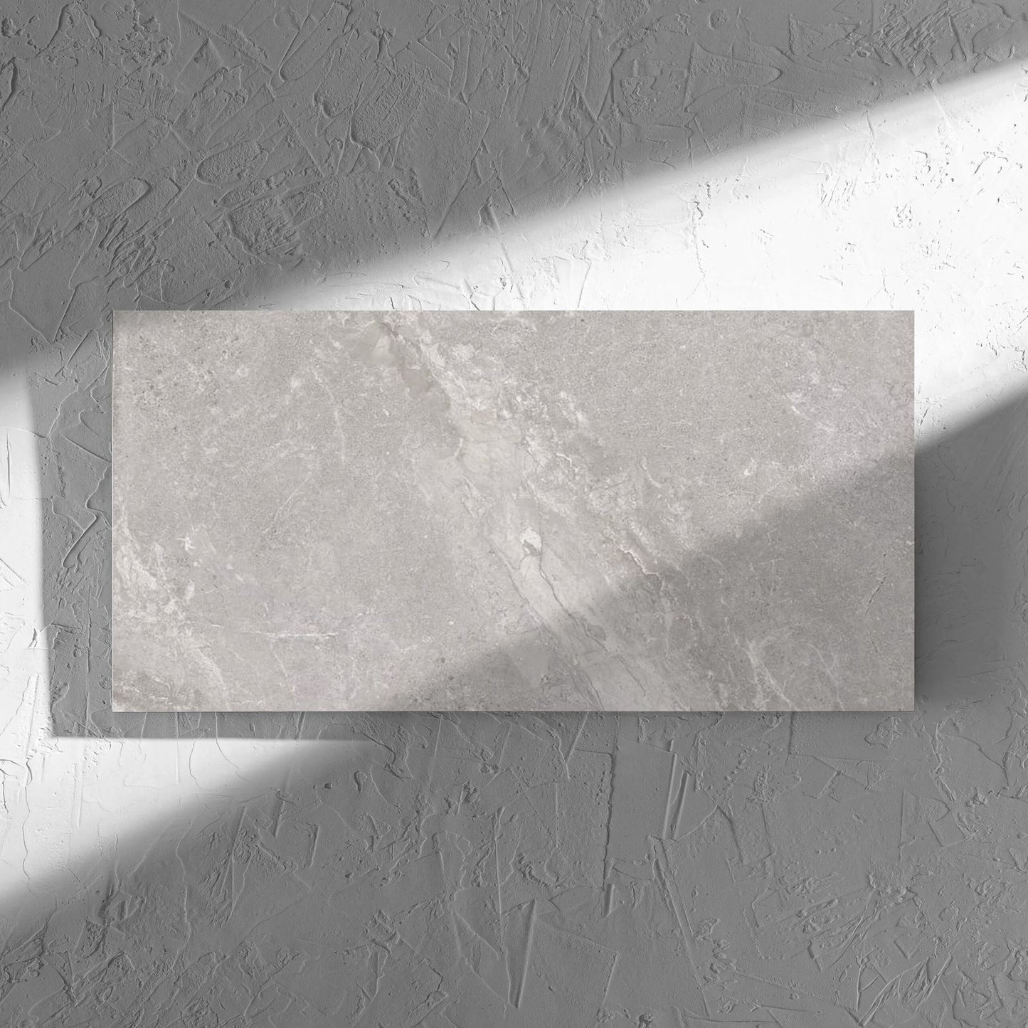Alpen Stone Grey 300x600mm tile in soft natural window light, showing the tile surface
