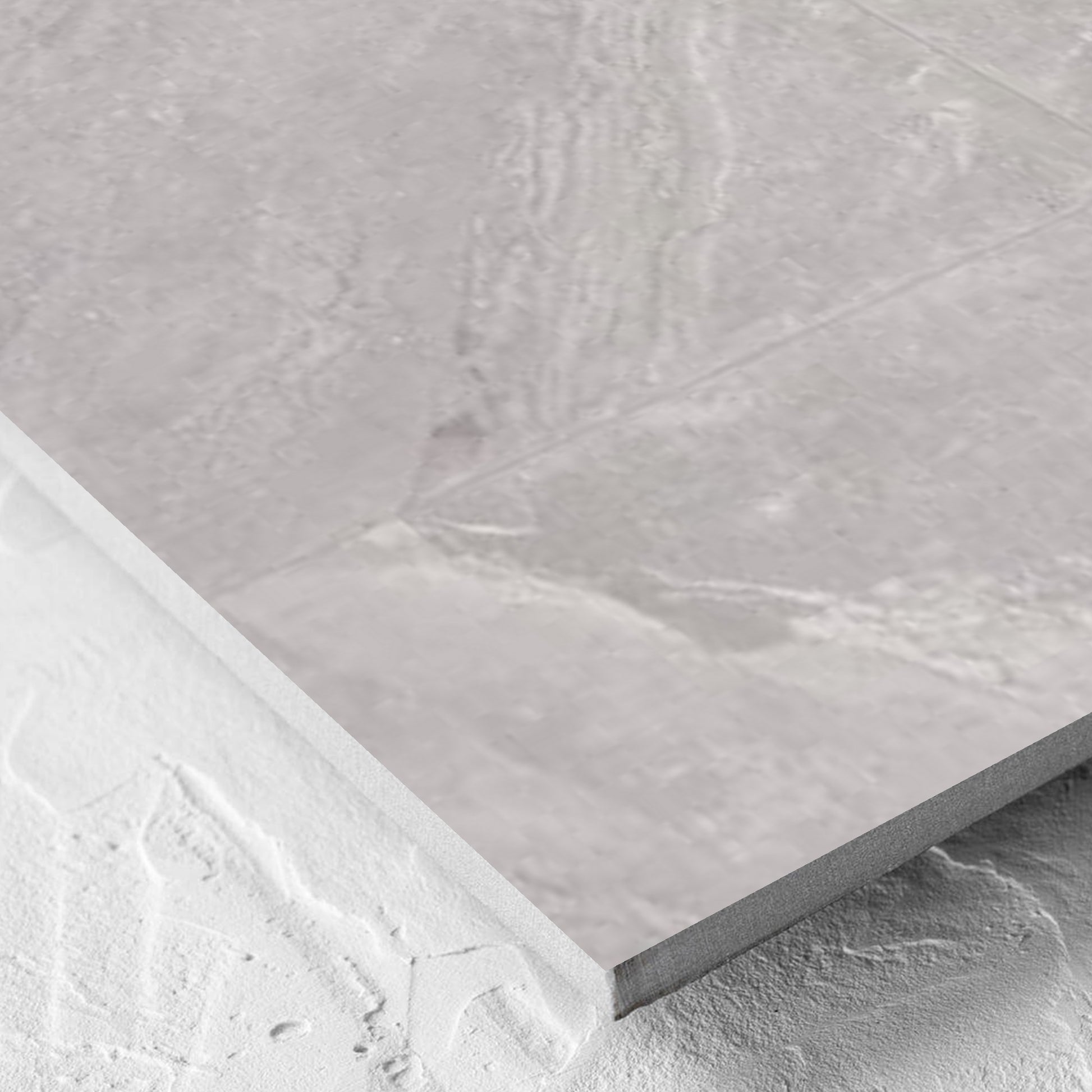 Corner close-up of the Alpen Stone Grey Lappato 600x600mm tile showing the tile surface and the edge profile