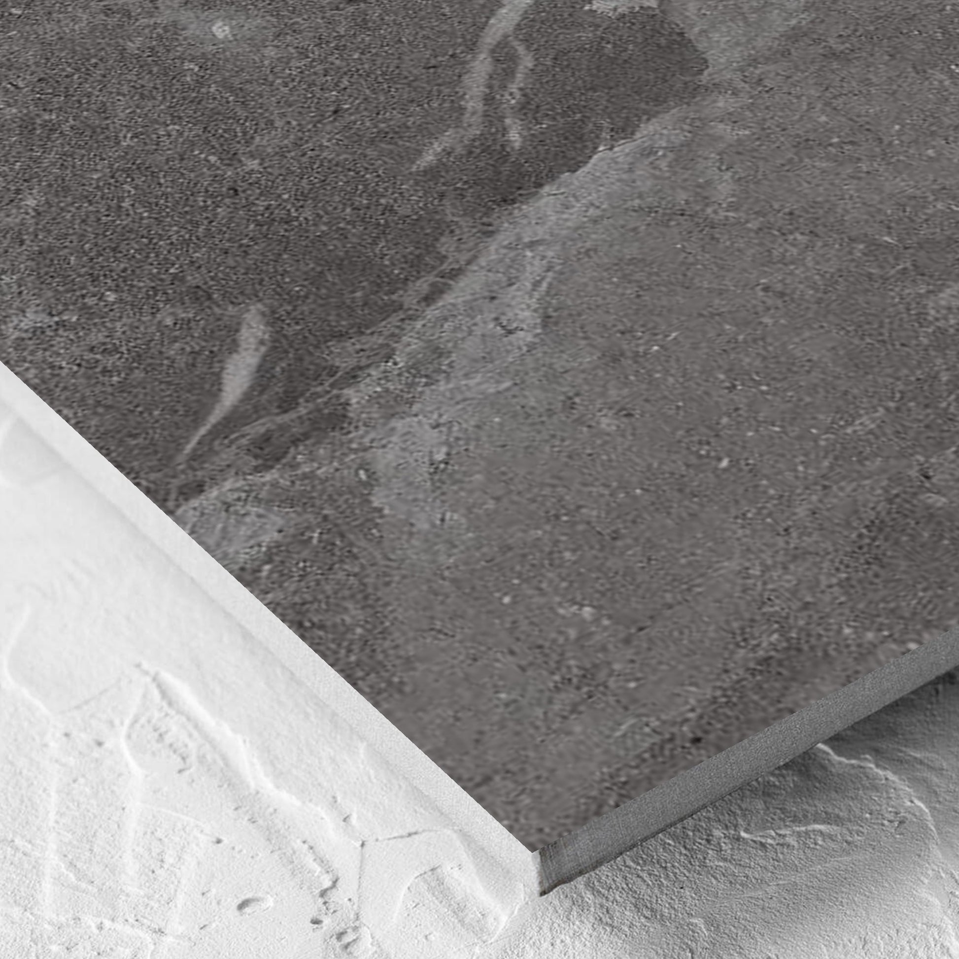 Corner close-up of the Alpen Stone Smoke 600x600mm tile showing the tile surface and the edge profile