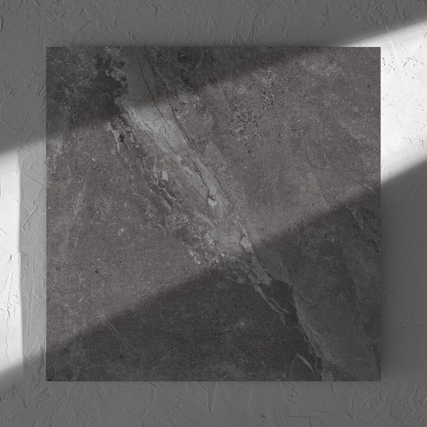Alpen Stone Smoke 600x600mm tile in soft natural window light, showing the tile surface
