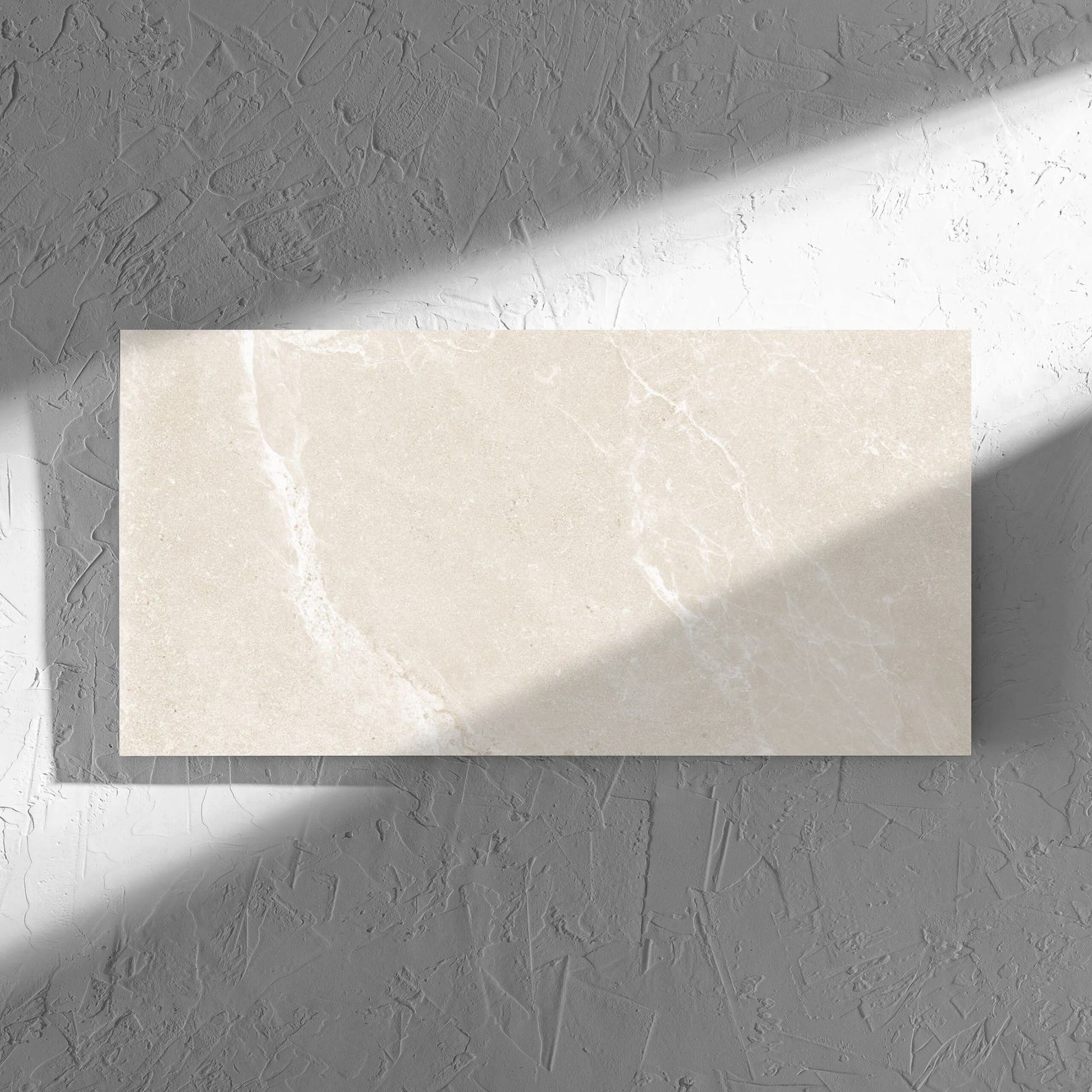 Alpen Stone Warm 300x600mm tile in soft natural window light, showing the tile surface