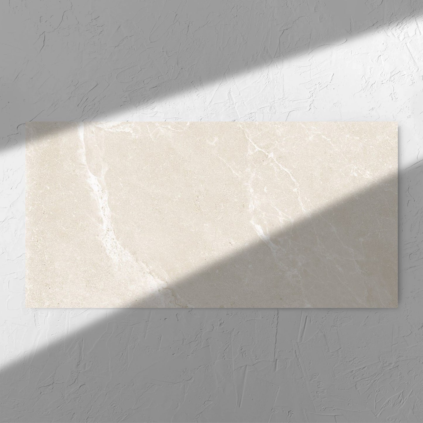 Alpen Stone Warm 600x1200mm tile in soft natural window light, showing the tile surface