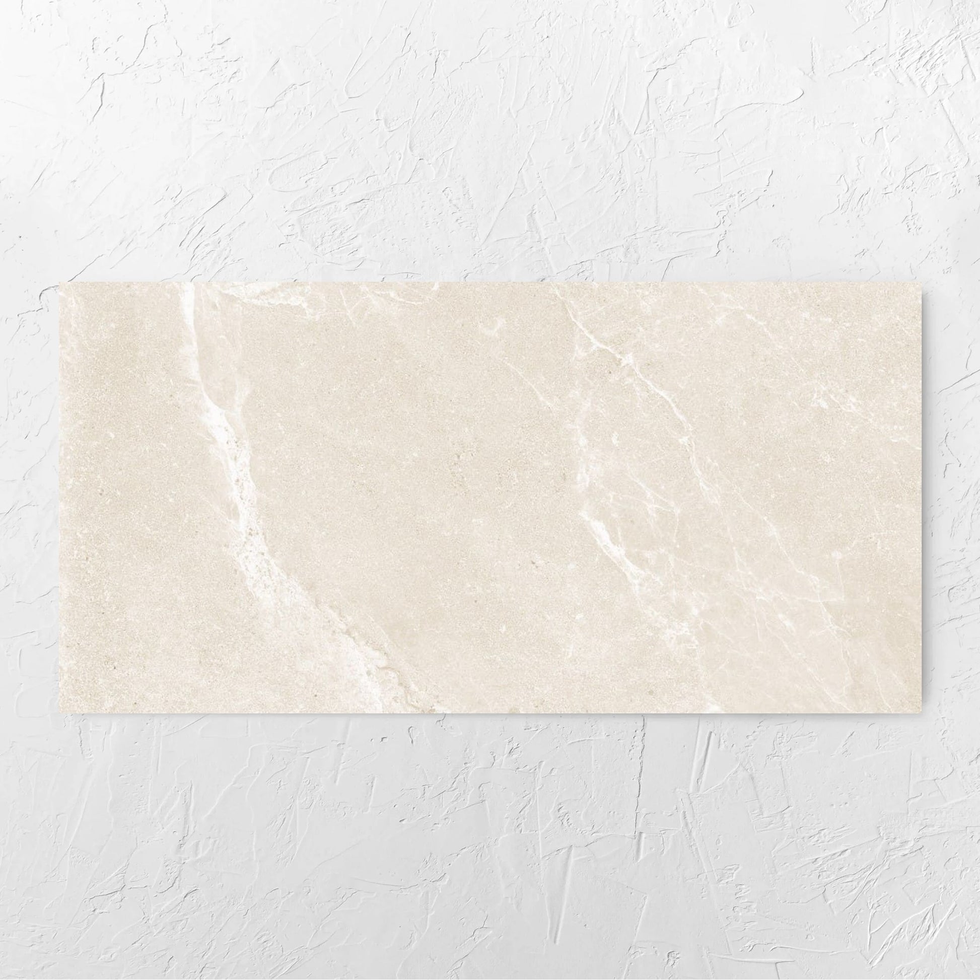 Alpen Stone Warm Lappato 600x1200mm tile laid flat on a white rendered wall, showing the tile surface