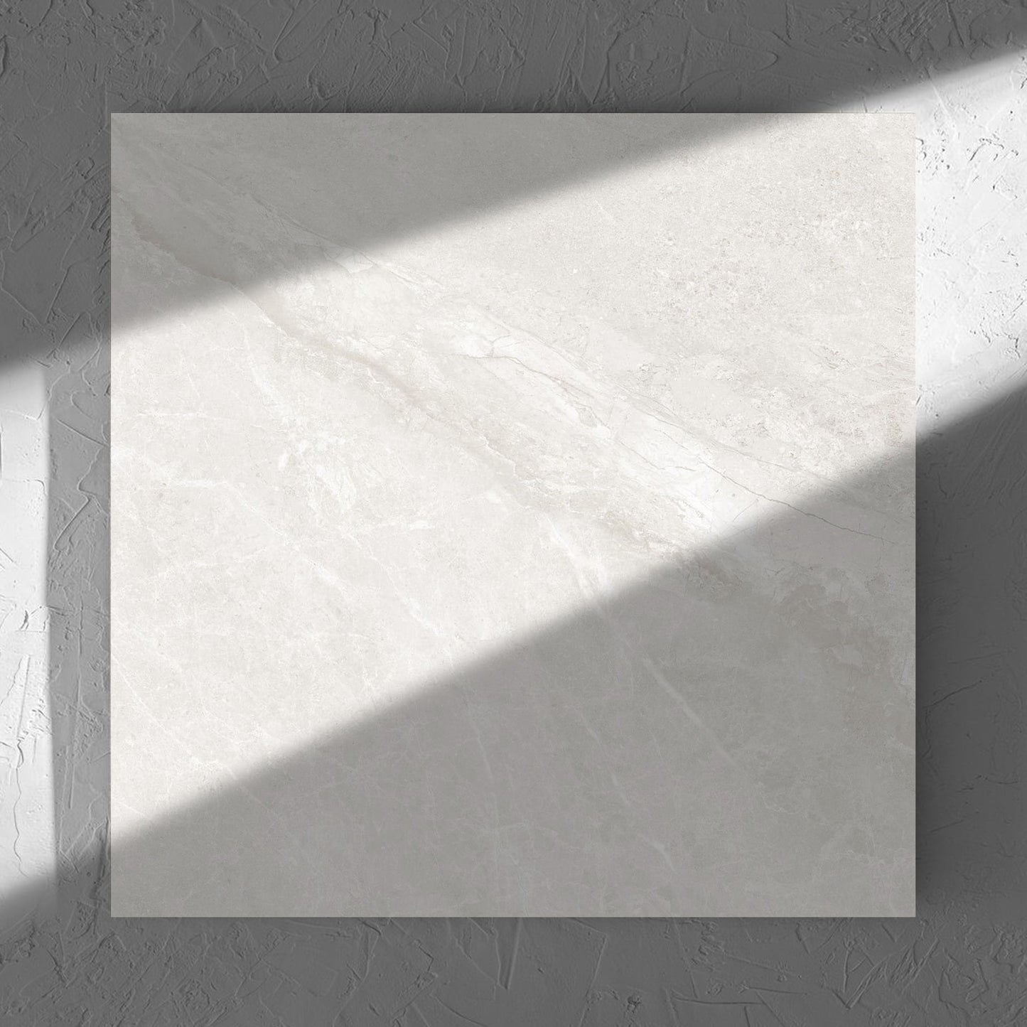 Alpen Stone White 600x600mm tile in soft natural window light, showing the tile surface