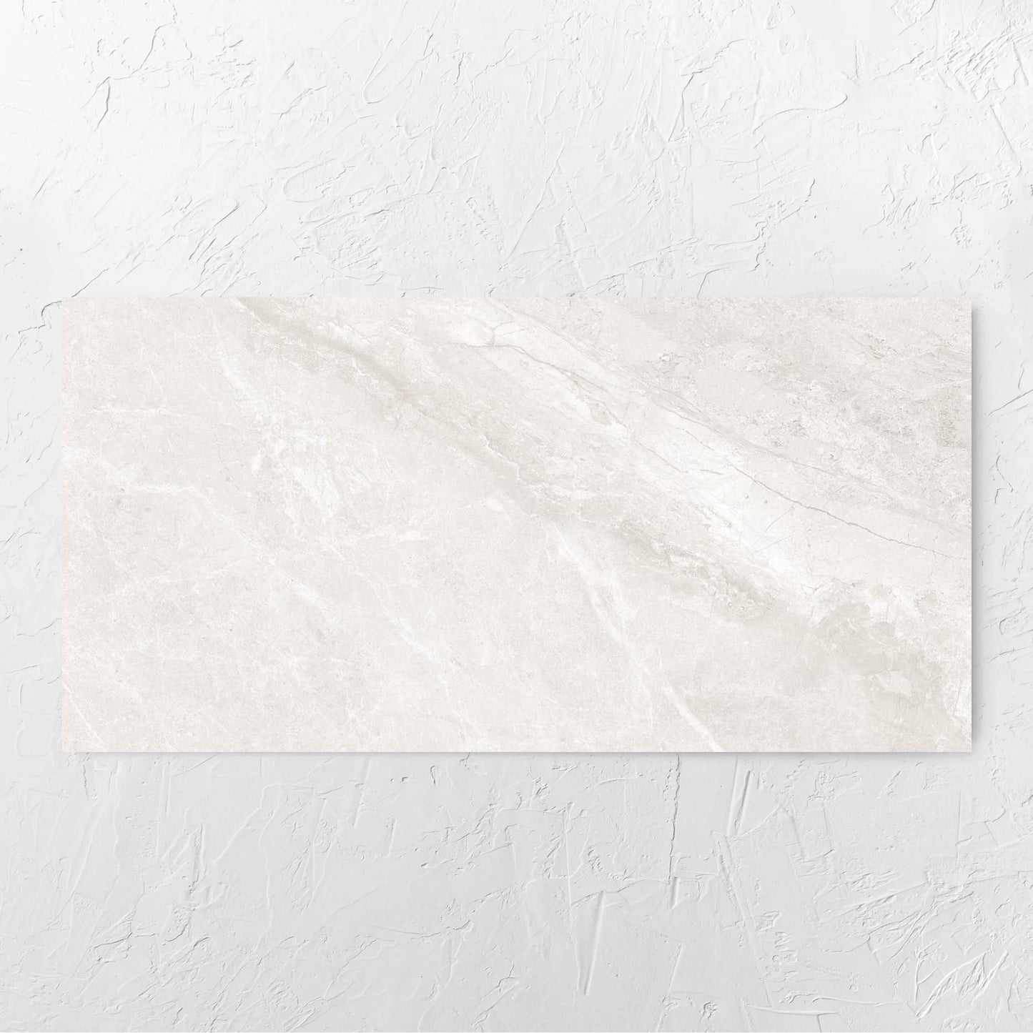 Alpen Stone White Lappato 600x1200mm tile laid flat on a white rendered wall, showing the white surface