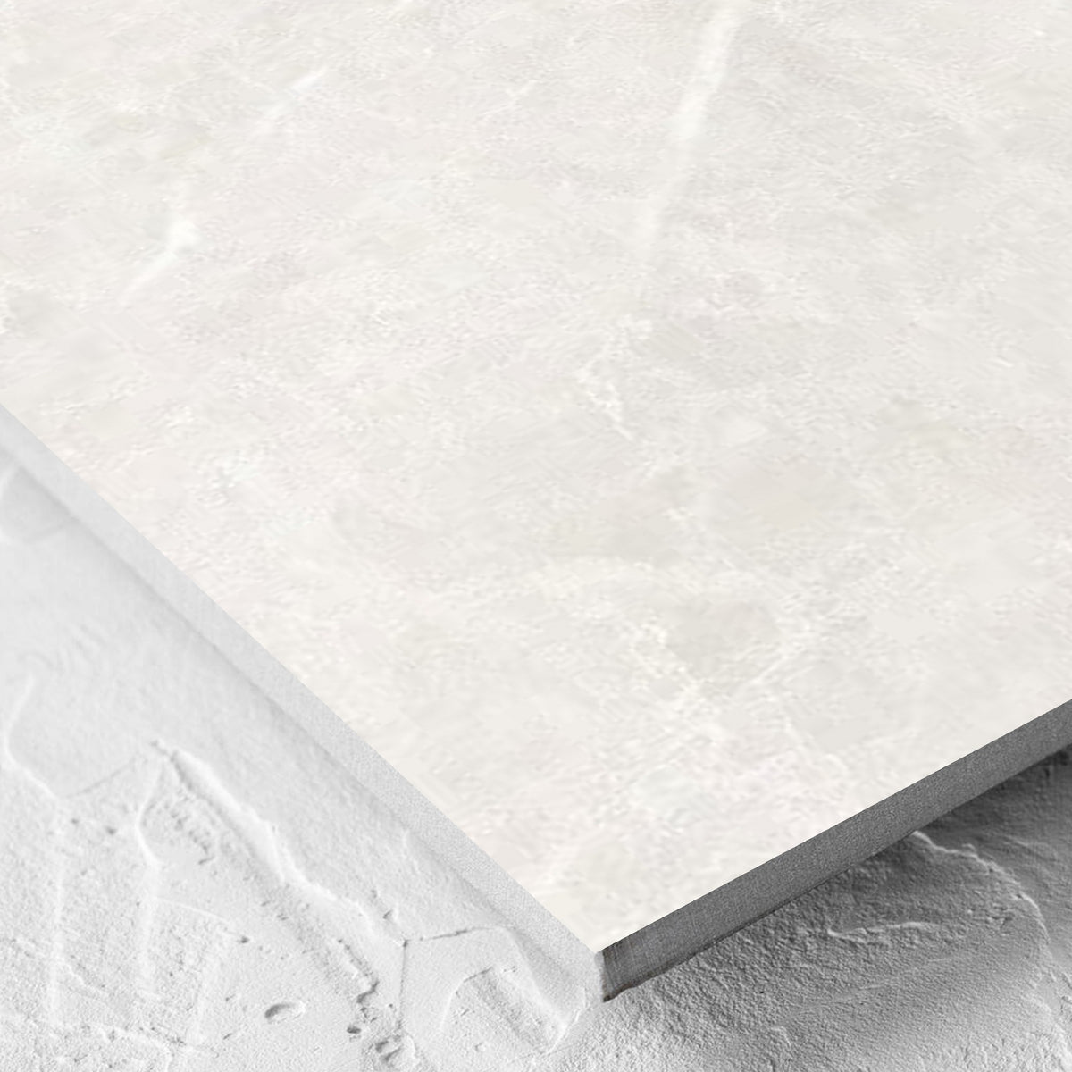 Corner close-up of the Alpen Stone White Lappato 600x600mm tile showing the tile surface and the edge profile