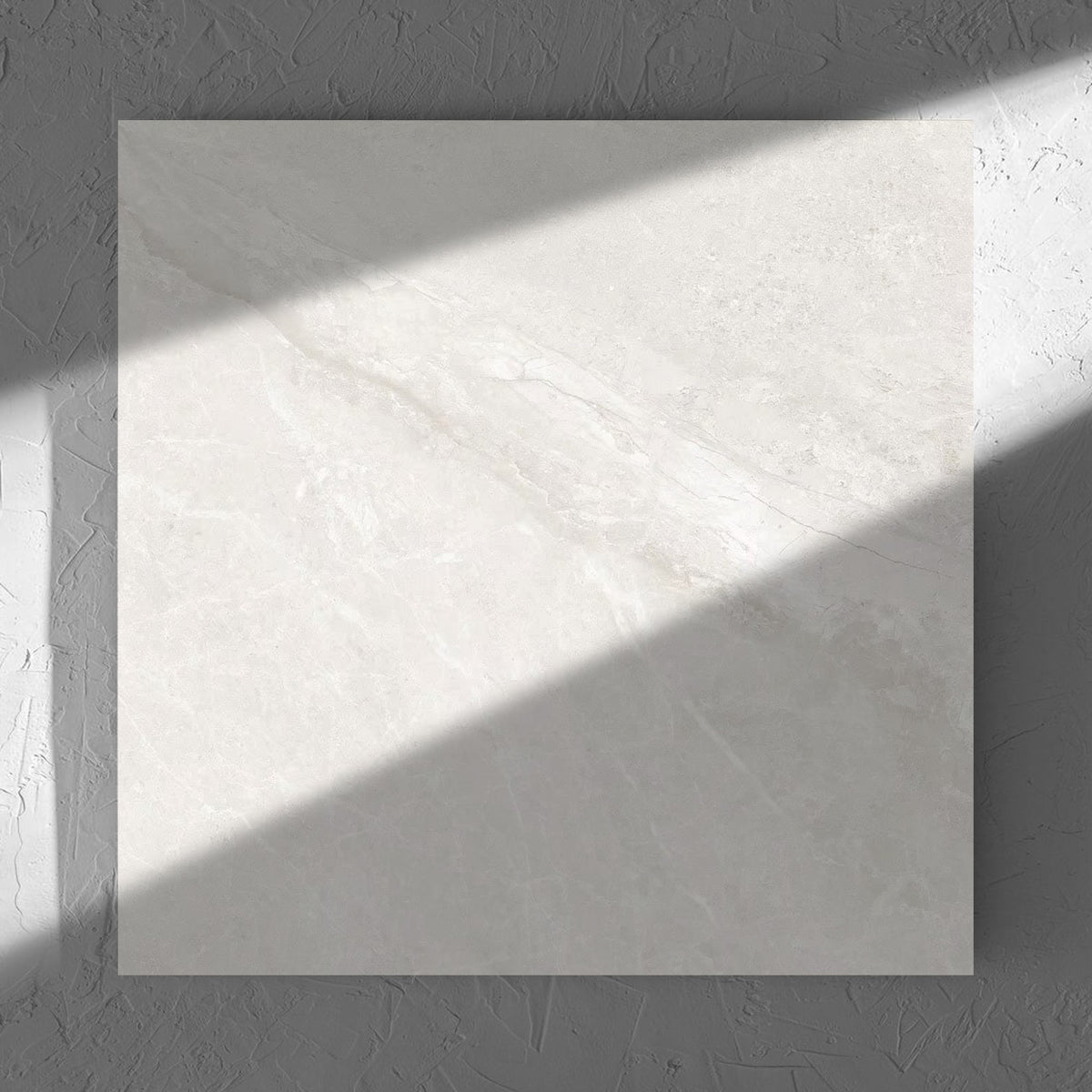 Alpen Stone White Lappato 600x600mm tile in soft natural window light, showing the tile surface