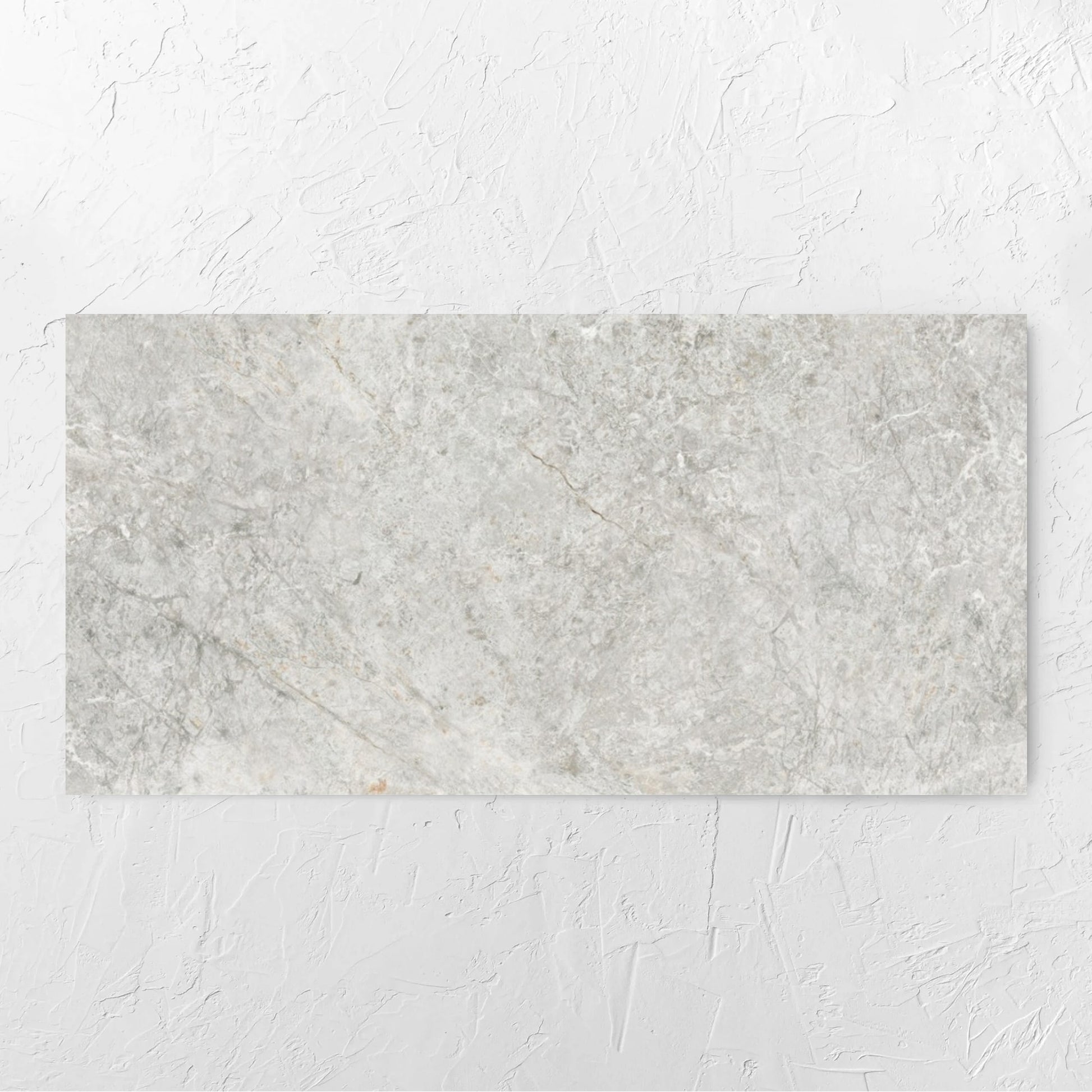 Antalya Beige Amber 600x1200mm tile laid flat on a white rendered wall, showing the matt surface