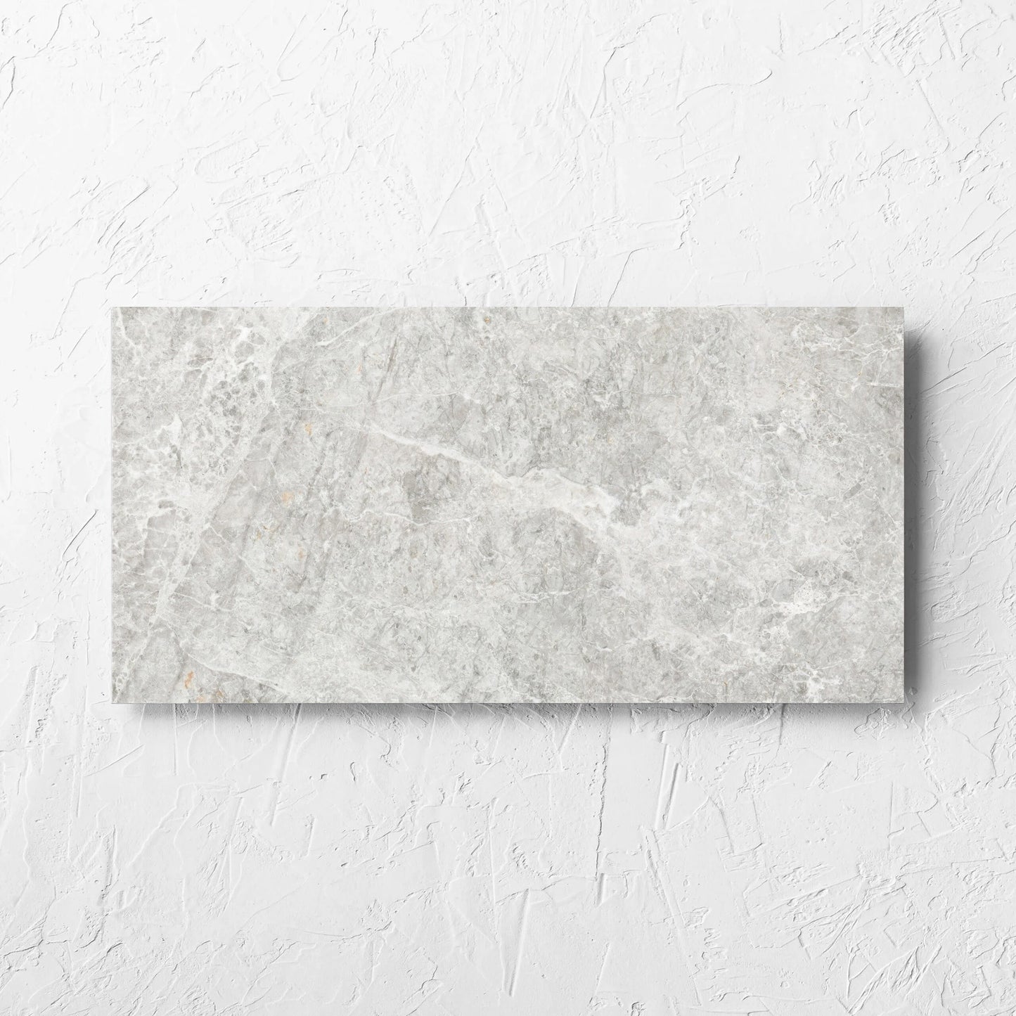 Antalya Beige Matt 300x600mm tile laid flat on a white rendered wall, showing the matt surface