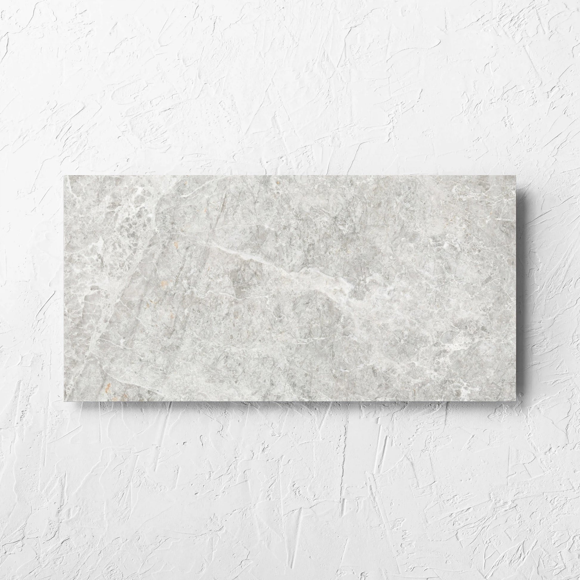 Antalya Beige Matt 300x600mm tile laid flat on a white rendered wall, showing the matt surface