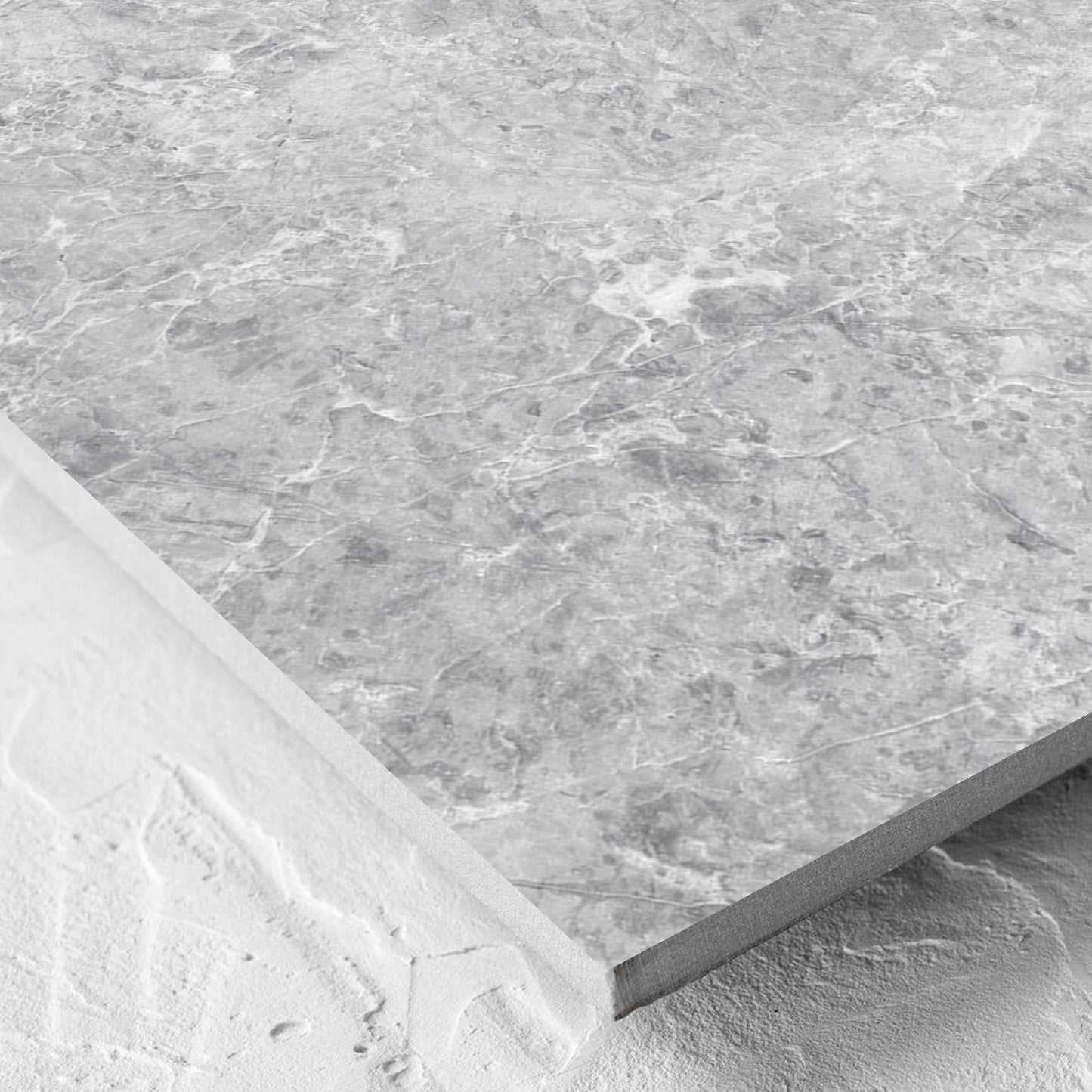 Corner close-up of the Antalya Silver Amber 600x600mm tile showing the matt surface and the edge profile