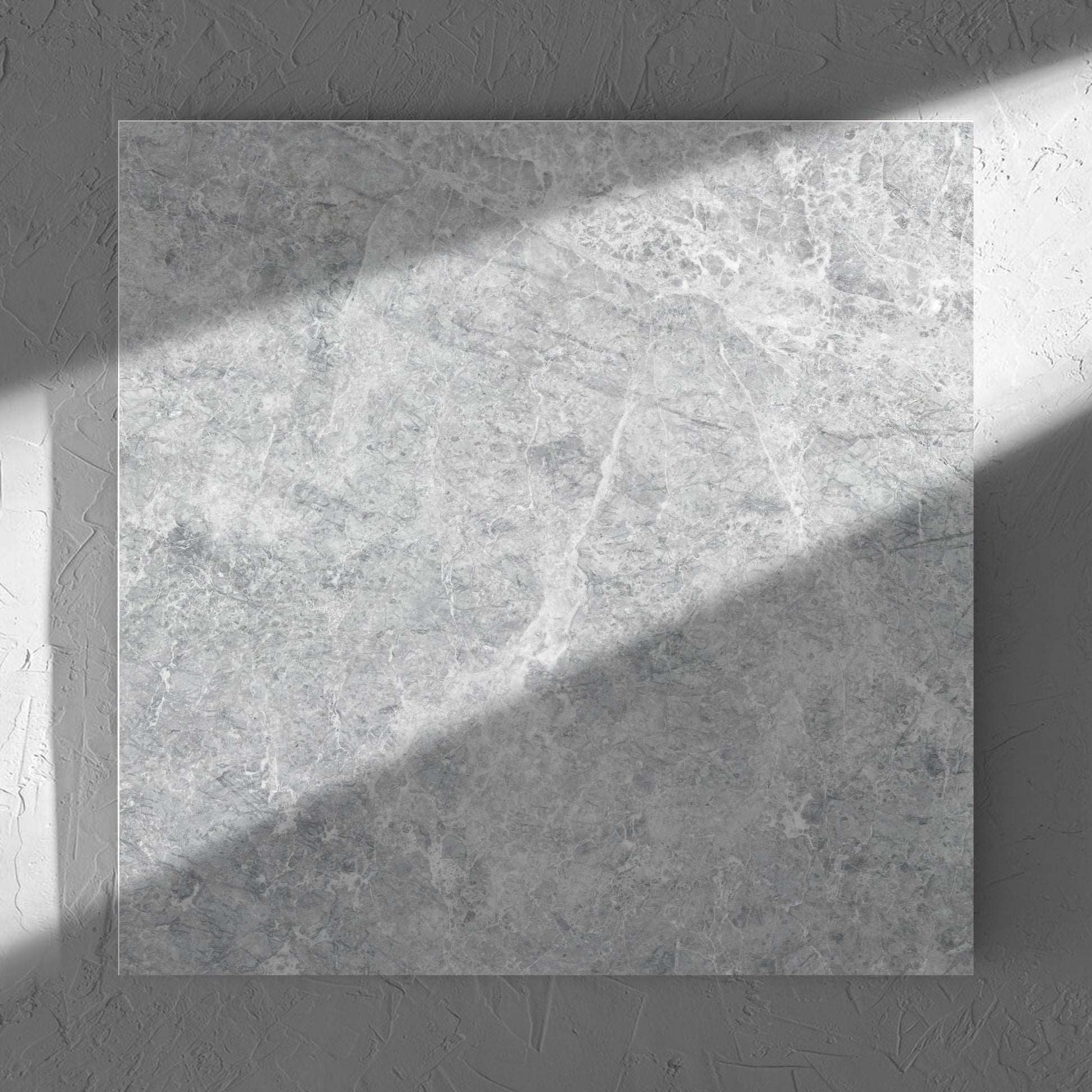 Antalya Silver Amber 600x600mm tile in soft natural window light, showing the matt surface
