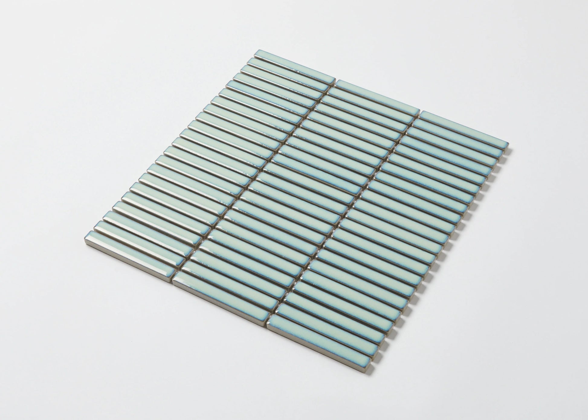 Pack shot of Antique Green Gloss Porcelain Glazed KitKat 12x92mm mosaic sheet showing slim horizontal aqua green glazed strips arranged in a parallel stack bond pattern.