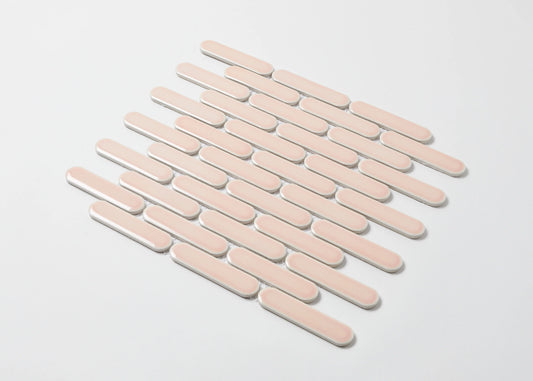 Pack shot of Antique Pink Gloss Round Head Finger Glazed Mosaic 23x93mm tiles arranged in a staggered diagonal pattern with white grout joints on a light background.