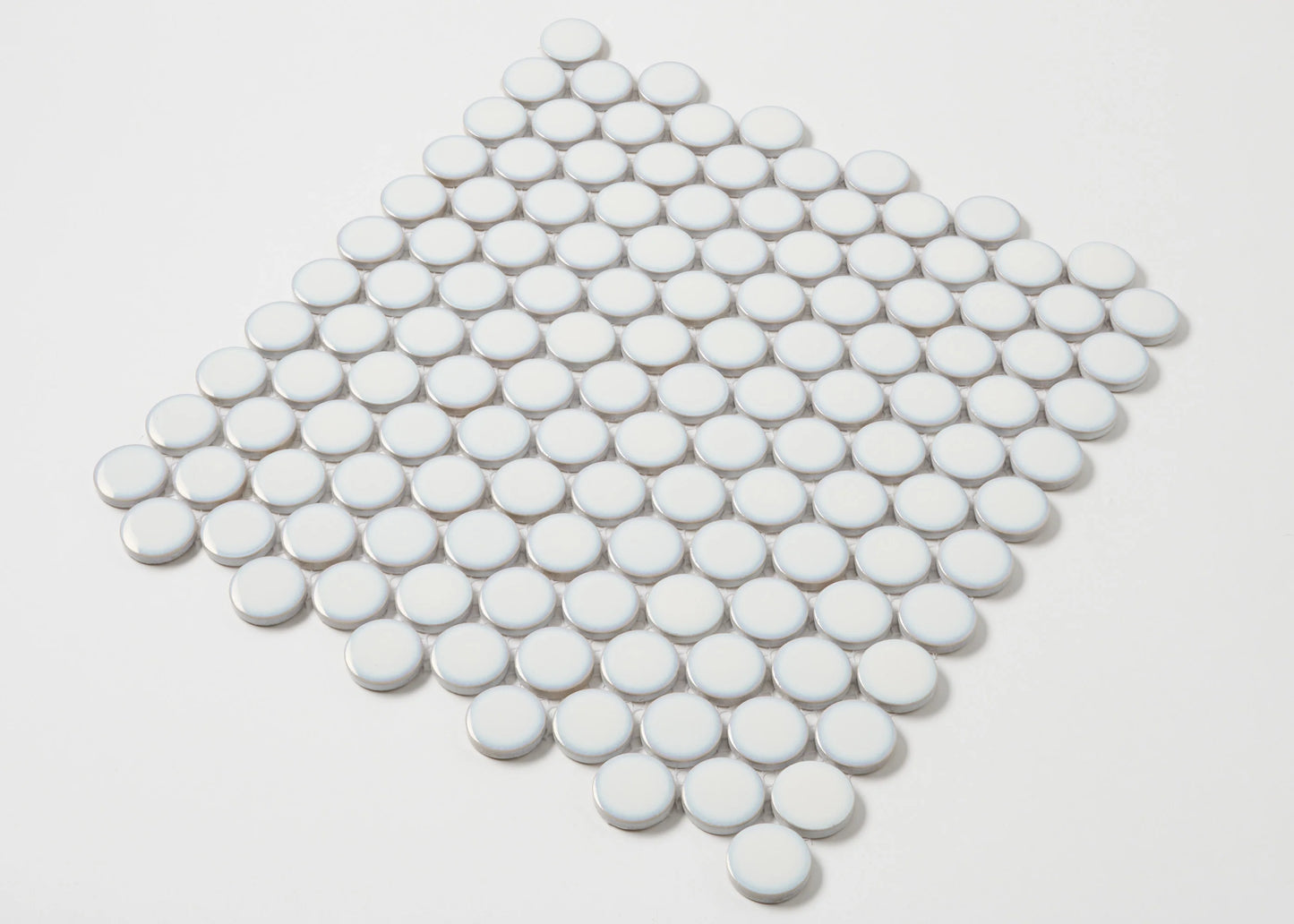 A flat-lay pack shot of Antique White Gloss Glazed Porcelain Penny Round 28mm Diameter mosaic tiles arranged in a diamond-shaped sheet showing their circular glossy finish.