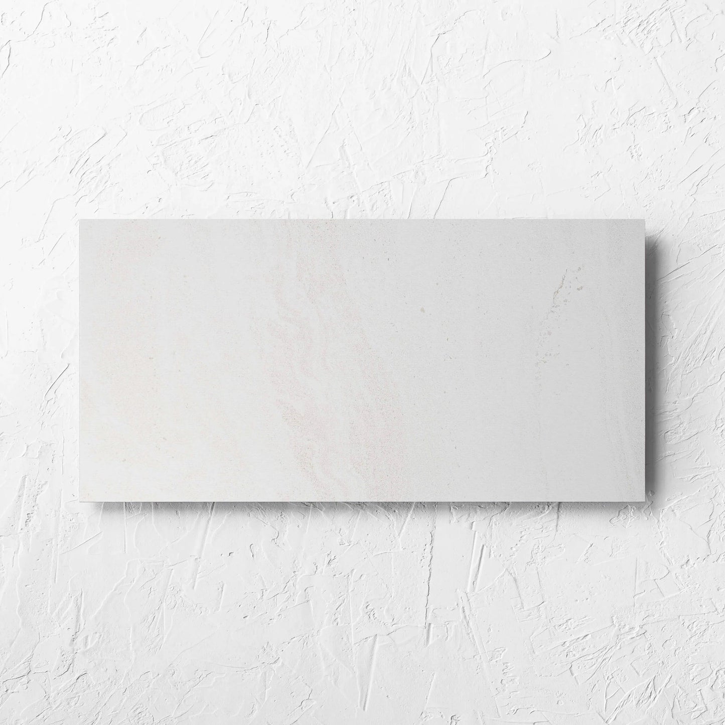 Argyle Stone Talco Lappato 300x600mm tile laid flat on a white rendered wall, showing the tile surface