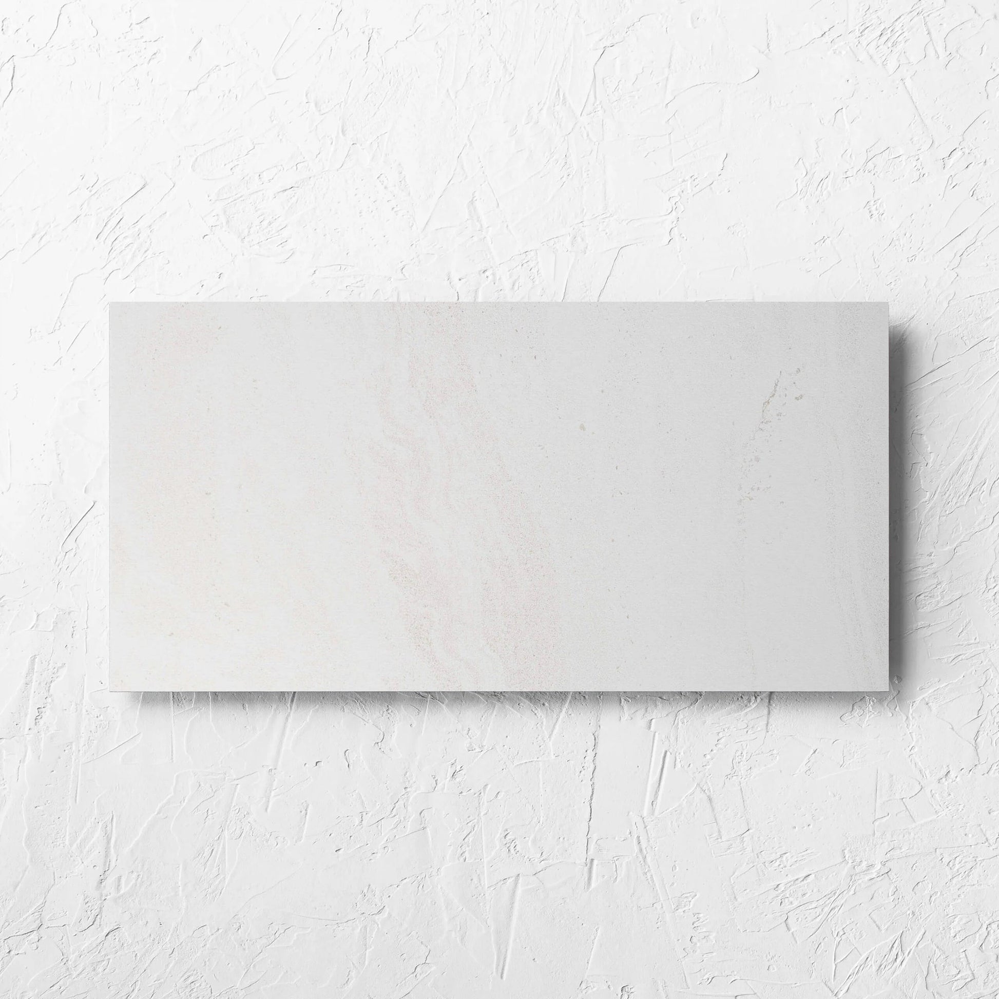 Argyle Stone Talco Lappato 300x600mm tile laid flat on a white rendered wall, showing the tile surface