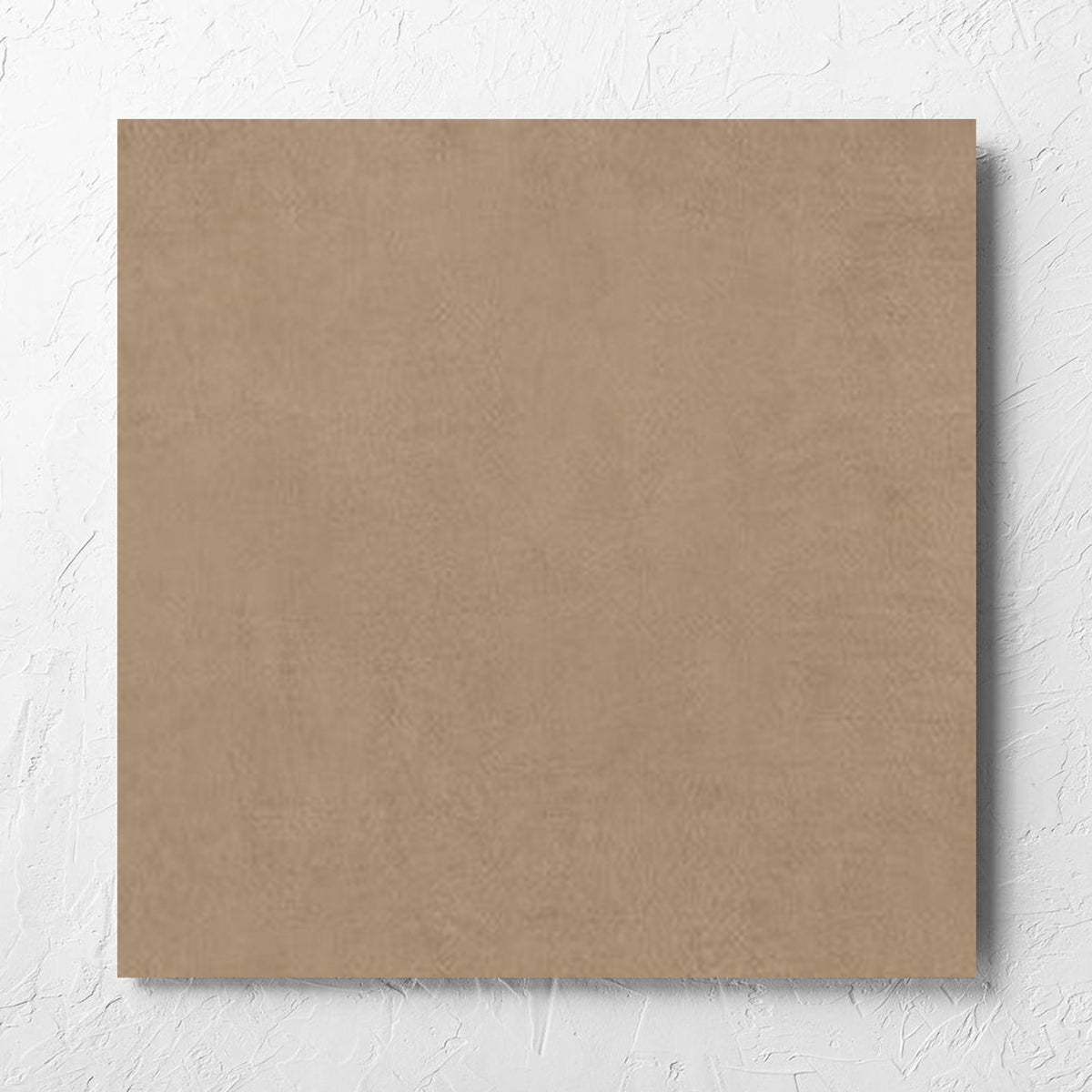 Balance Tan Matt 600x600mm tile laid flat on a white rendered wall, showing the tile surface